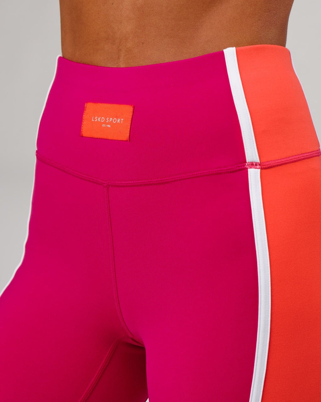 Model wearing Hunter Mid Short Tight - Boysenberry-Fruit Punch