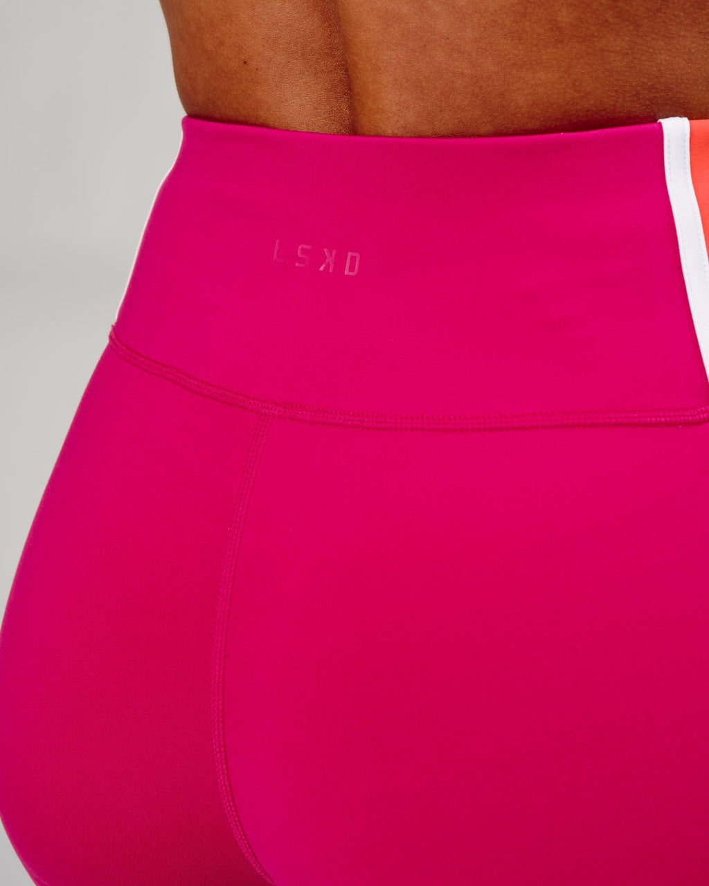 Model wearing Hunter Mid Short Tight - Boysenberry-Fruit Punch