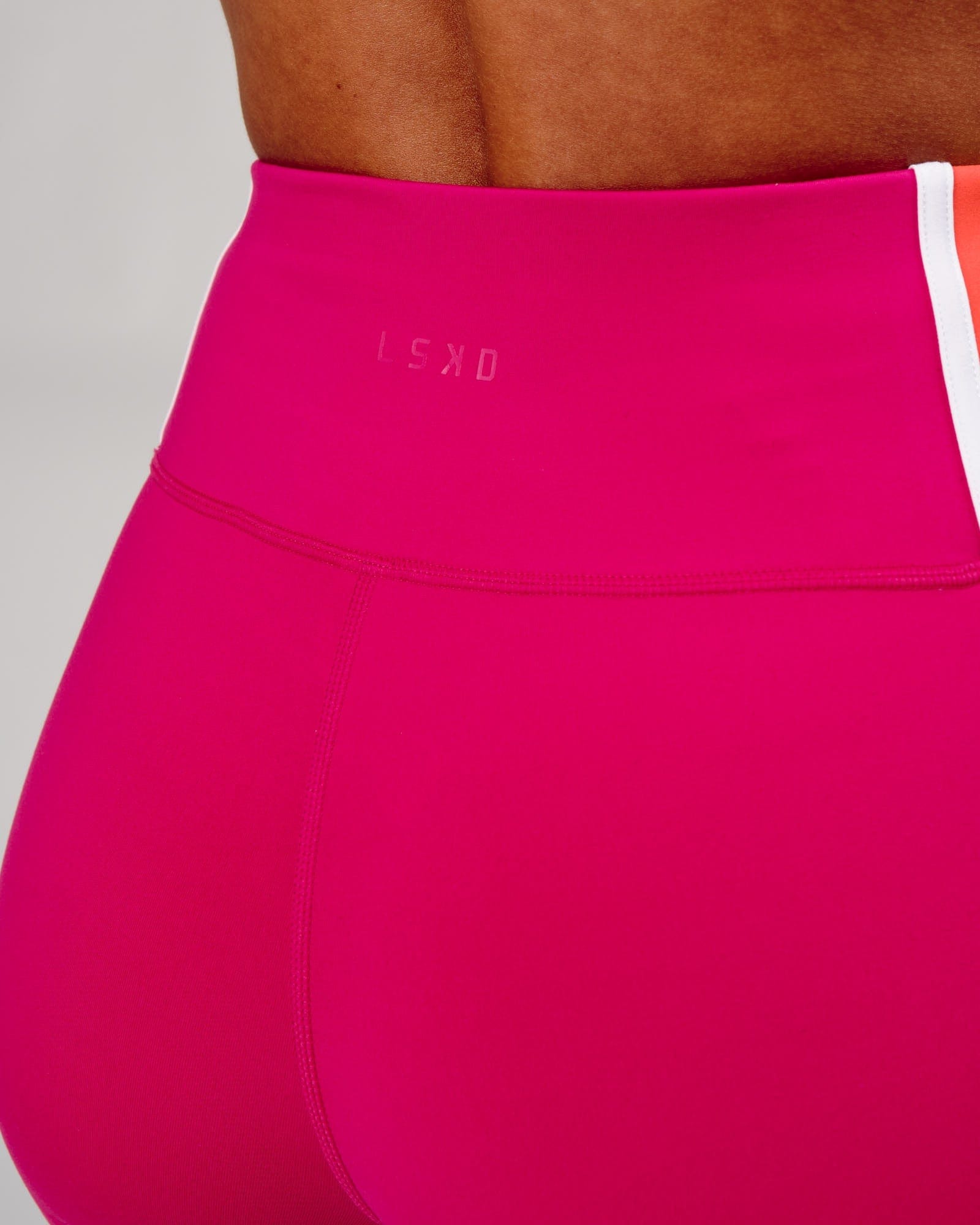 Model wearing Hunter Mid Short Tight - Boysenberry-Fruit Punch