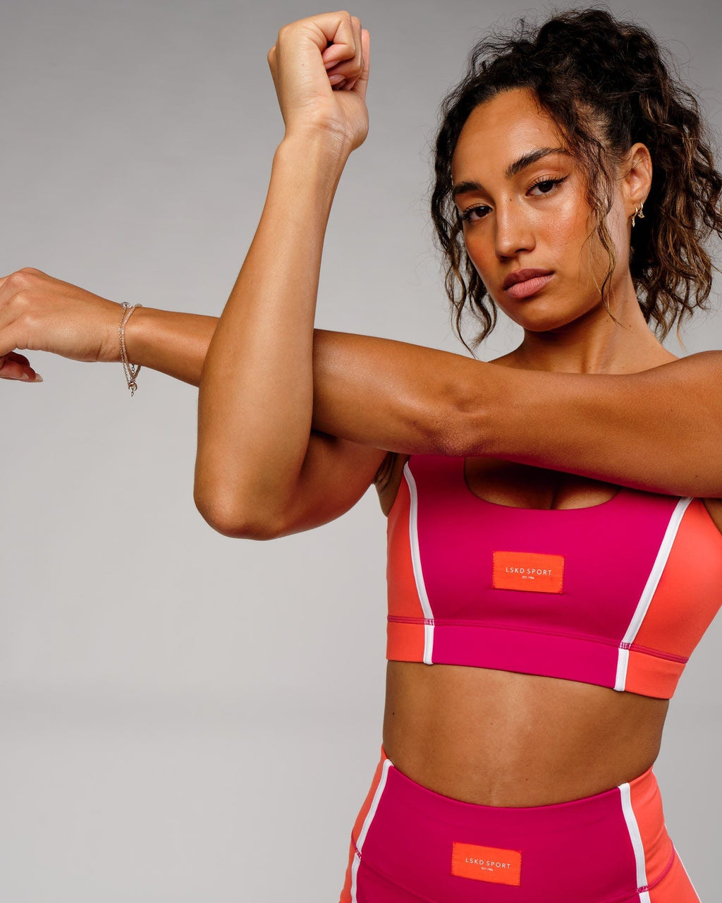 Model wearing Hunter Sports Bra - Boysenberry-Fruit Punch