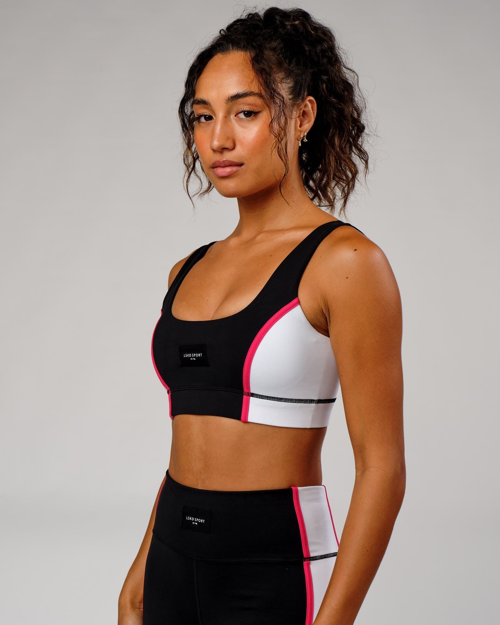 Model wearing Hunter Sports Bra - Black-White-Boysenberry