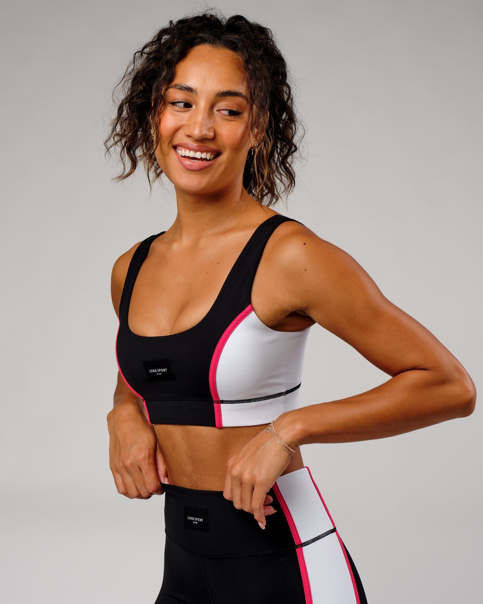 Model wearing Hunter Sports Bra - Black-White-Boysenberry