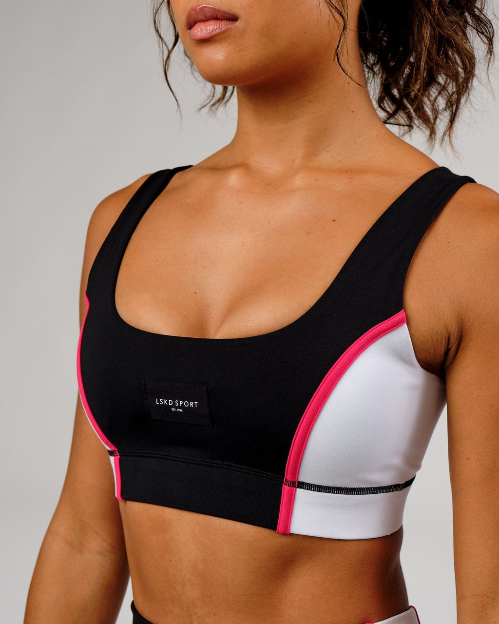 Model wearing Hunter Sports Bra - Black-White-Boysenberry