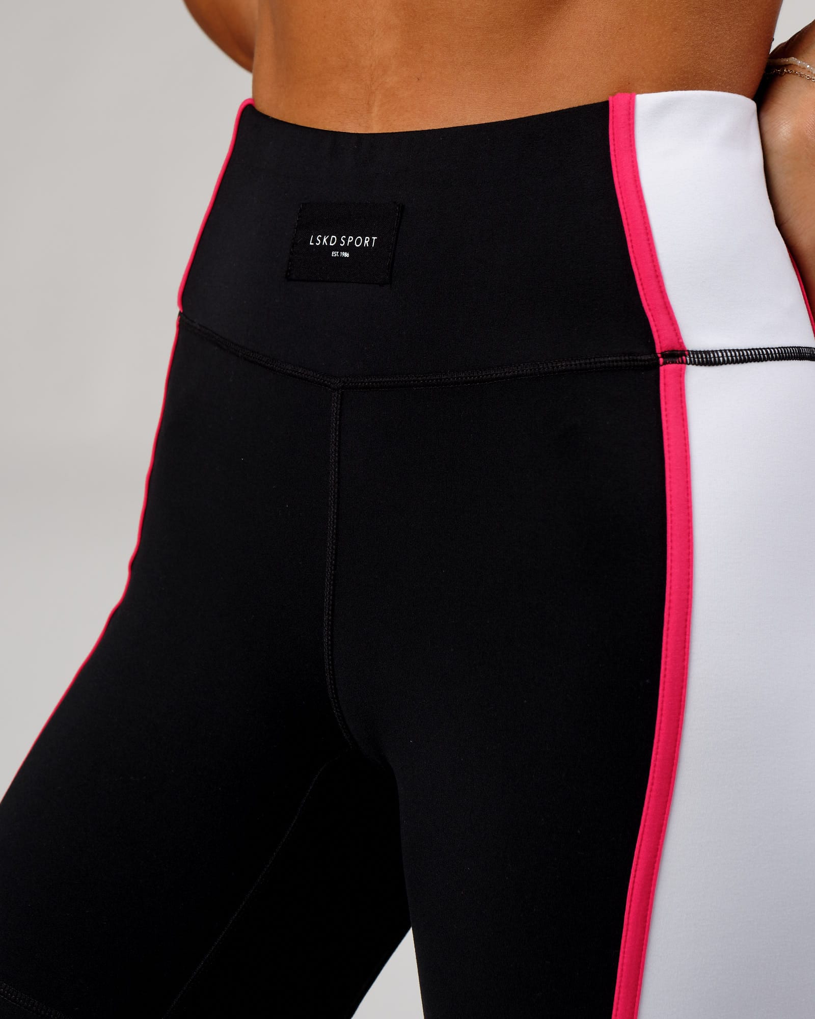 Model wearing Hunter Mid Short Tight - Black-White-Boysenberry