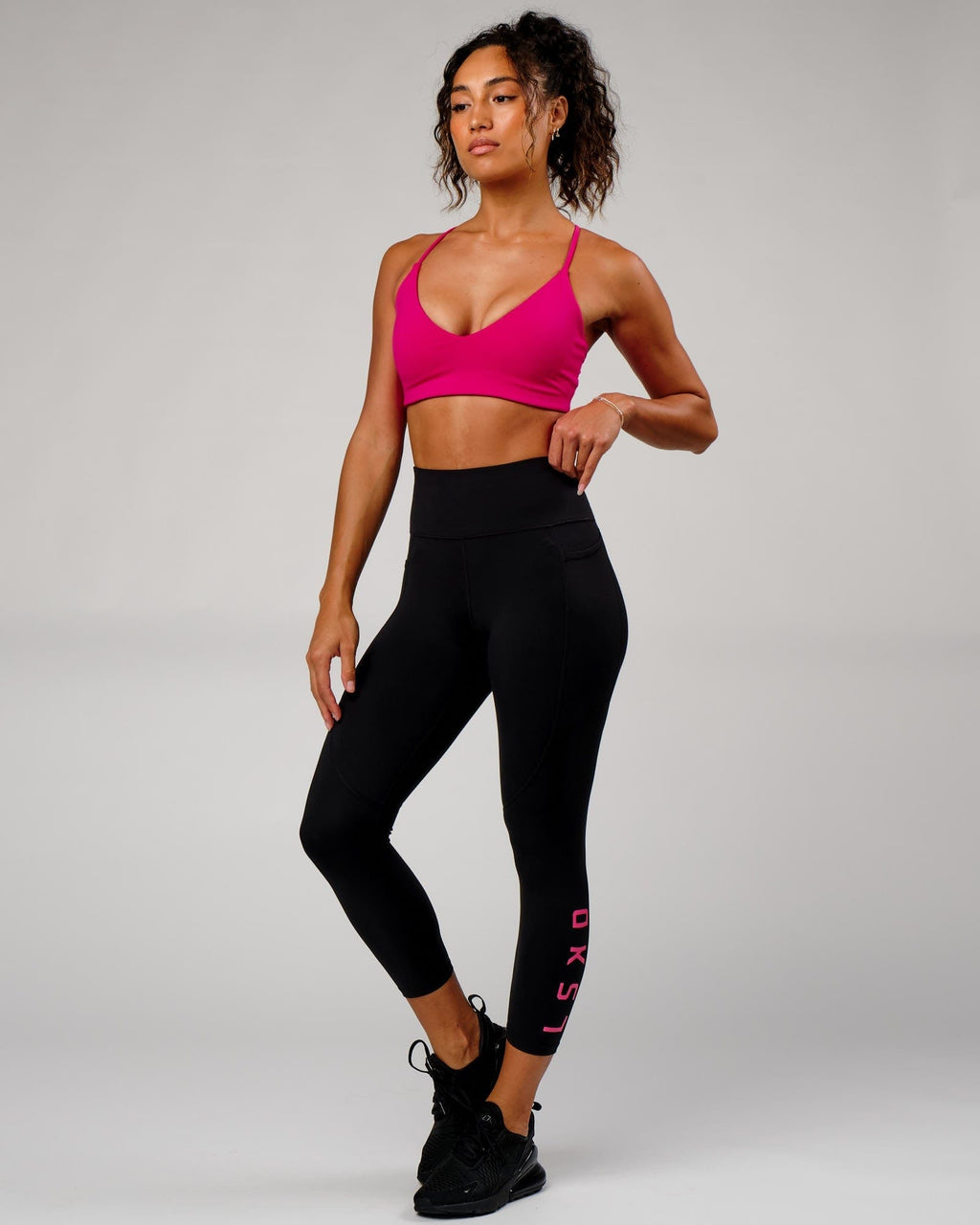 Model wearing Rep 7/8 Length Tight - Black-Boysenberry