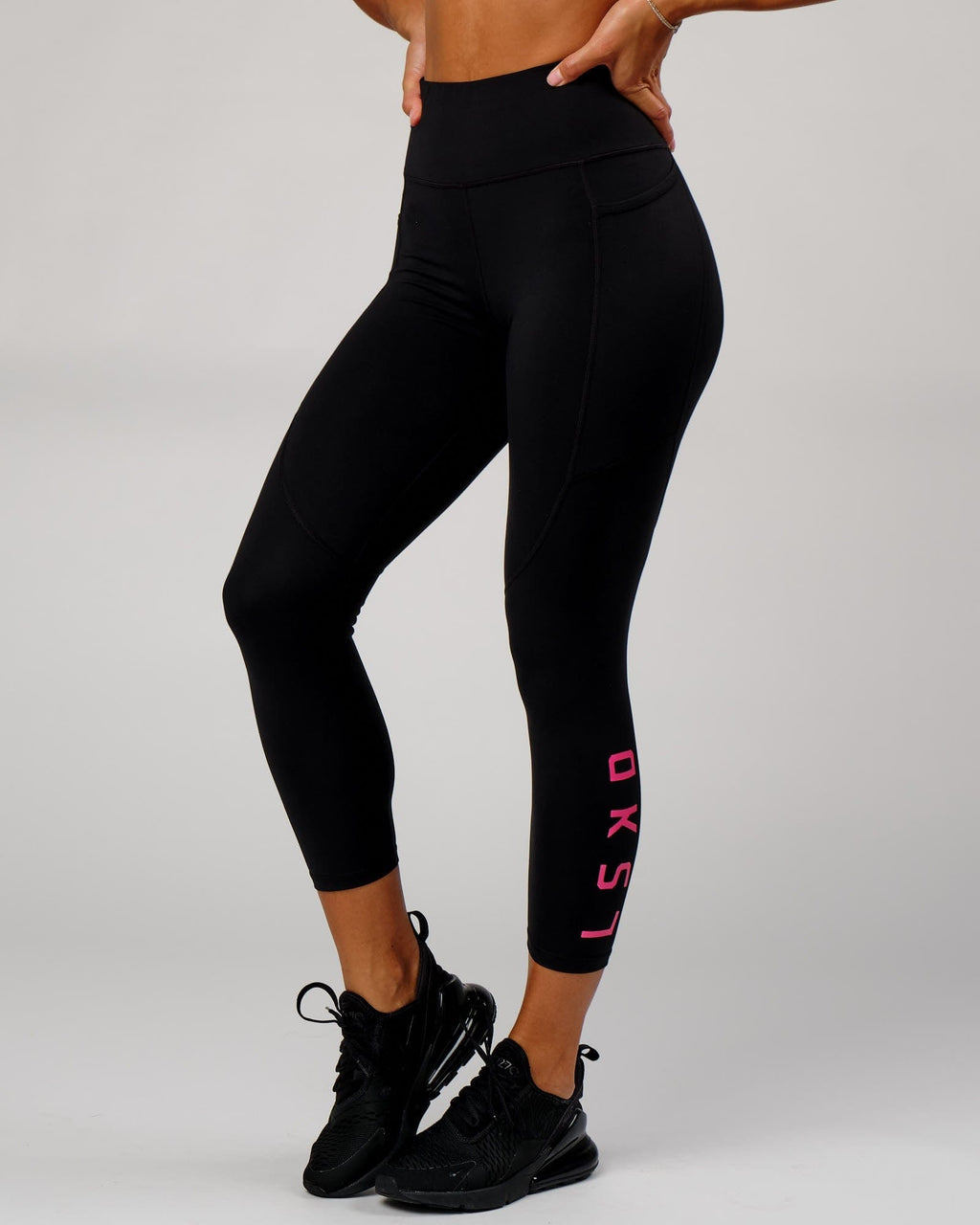 Model wearing Rep 7/8 Length Tight - Black-Boysenberry