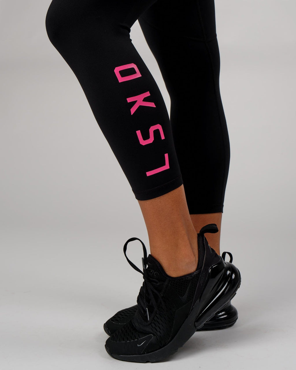 Model wearing Rep 7/8 Length Tight - Black-Boysenberry