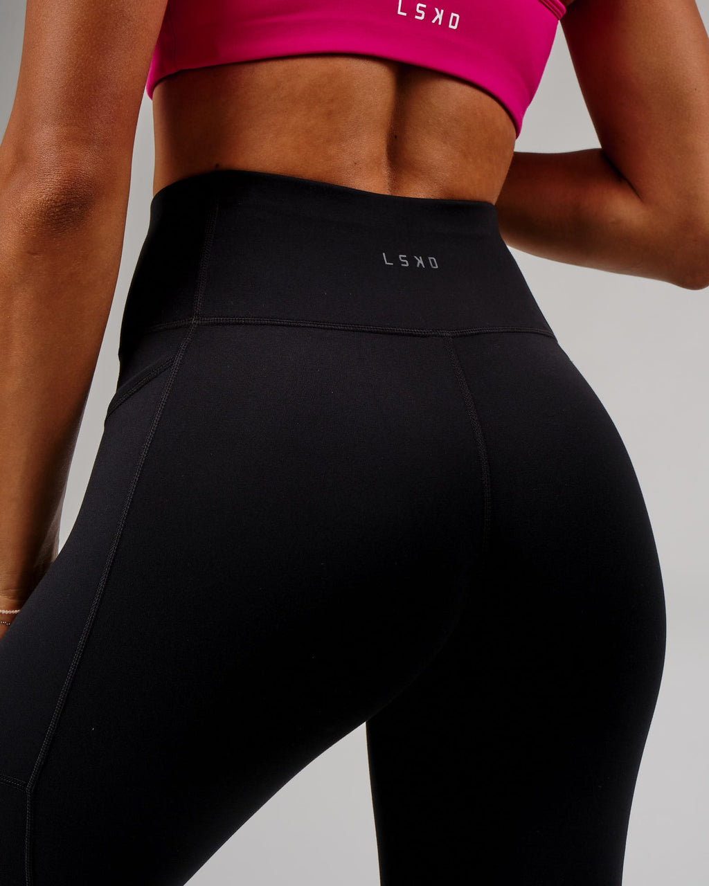 Model wearing Rep 7/8 Length Tight - Black-Boysenberry