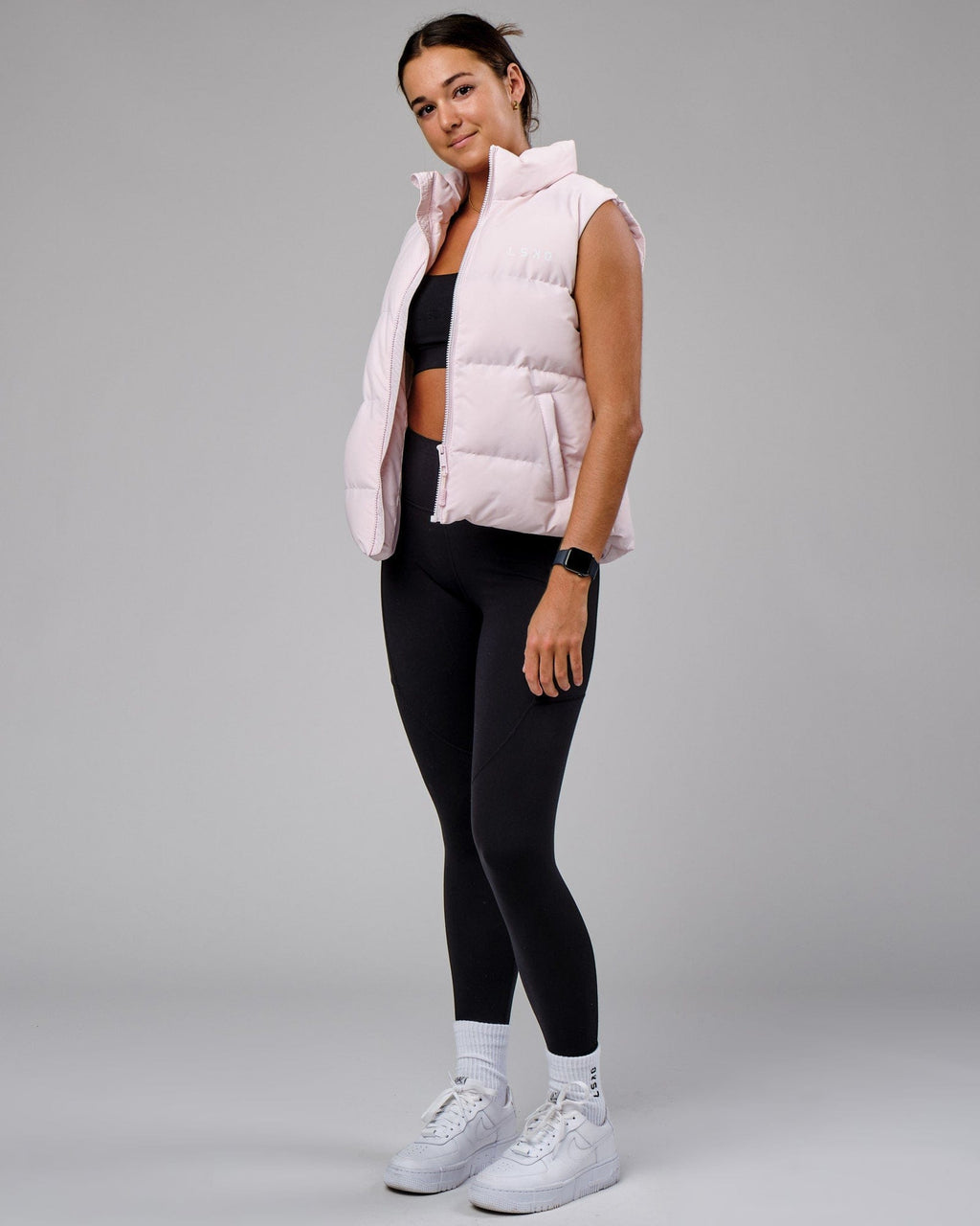 Model wearing Essential Puffer Vest - Orchid ice