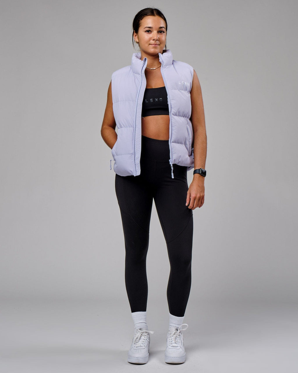 Model wearing Essential Puffer Vest - Cosmic Sky