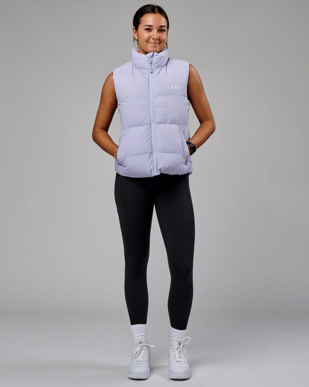 Model wearing Essential Puffer Vest - Cosmic Sky