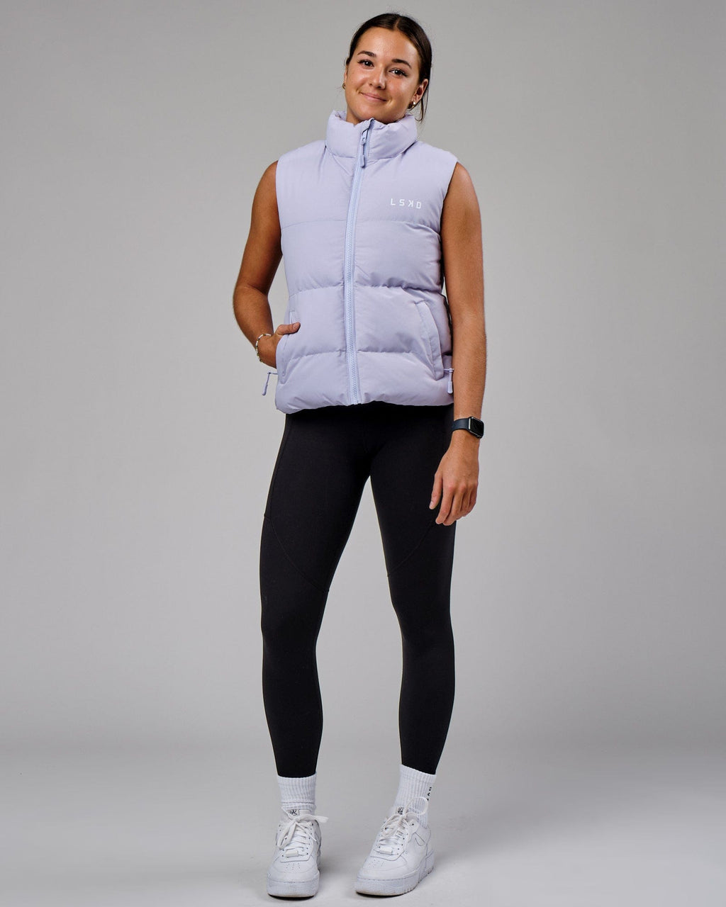 Model wearing Essential Puffer Vest - Cosmic Sky