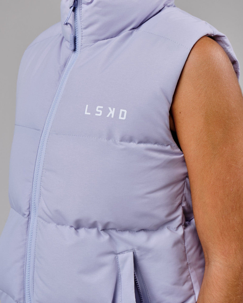 Model wearing Essential Puffer Vest - Cosmic Sky