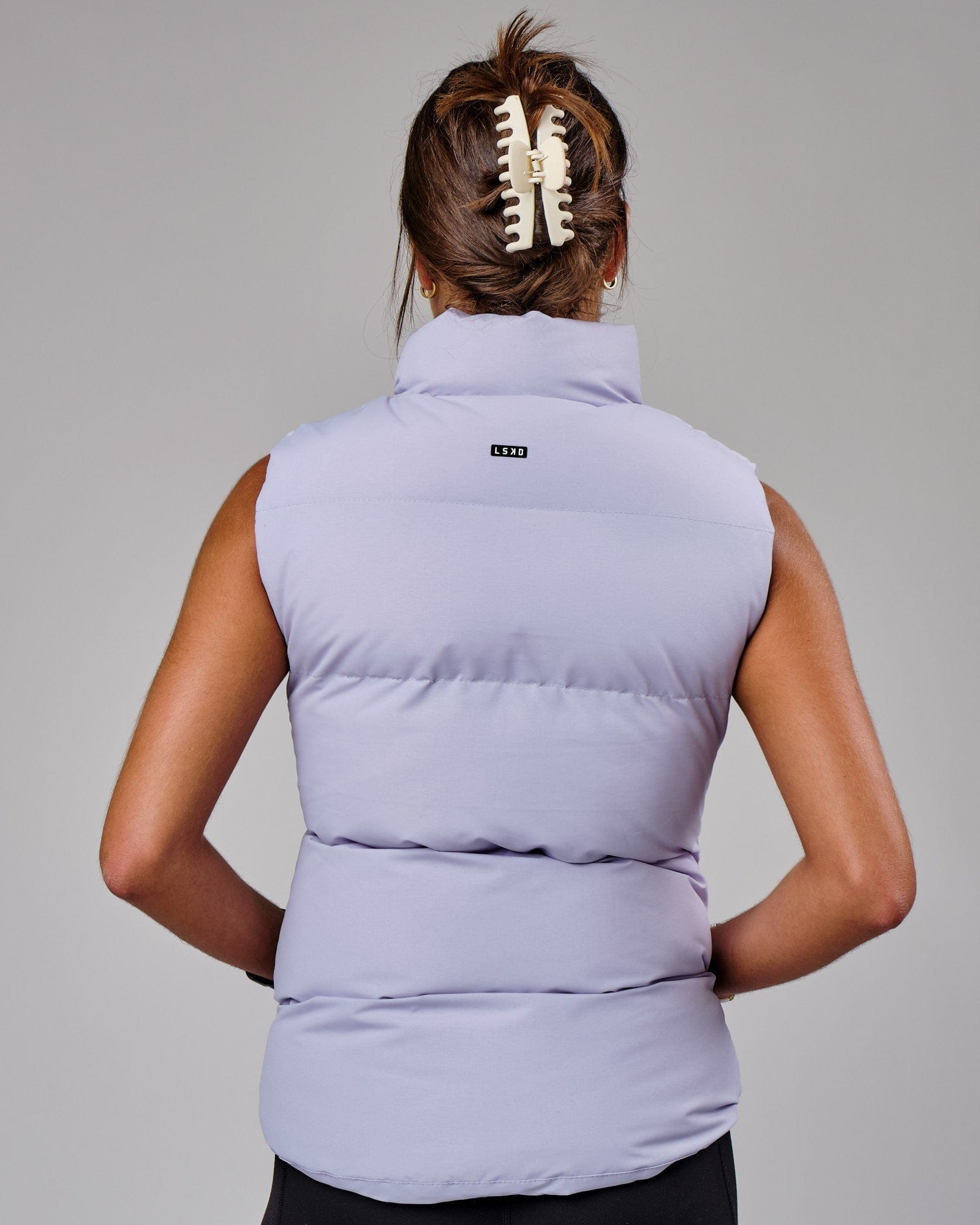 Model wearing Essential Puffer Vest - Cosmic Sky