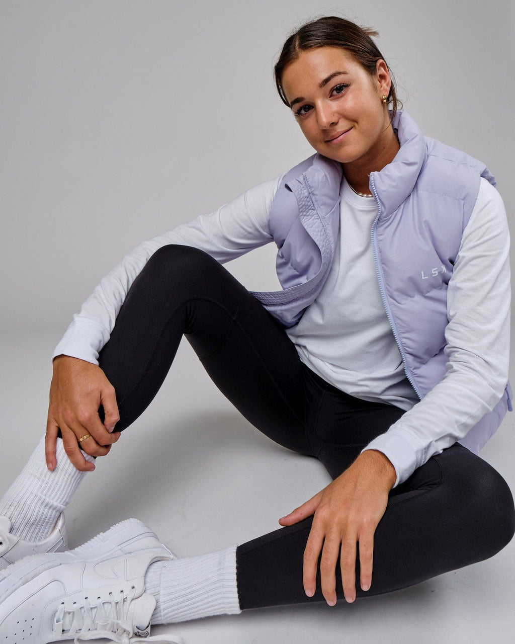 Model wearing Essential Puffer Vest - Cosmic Sky