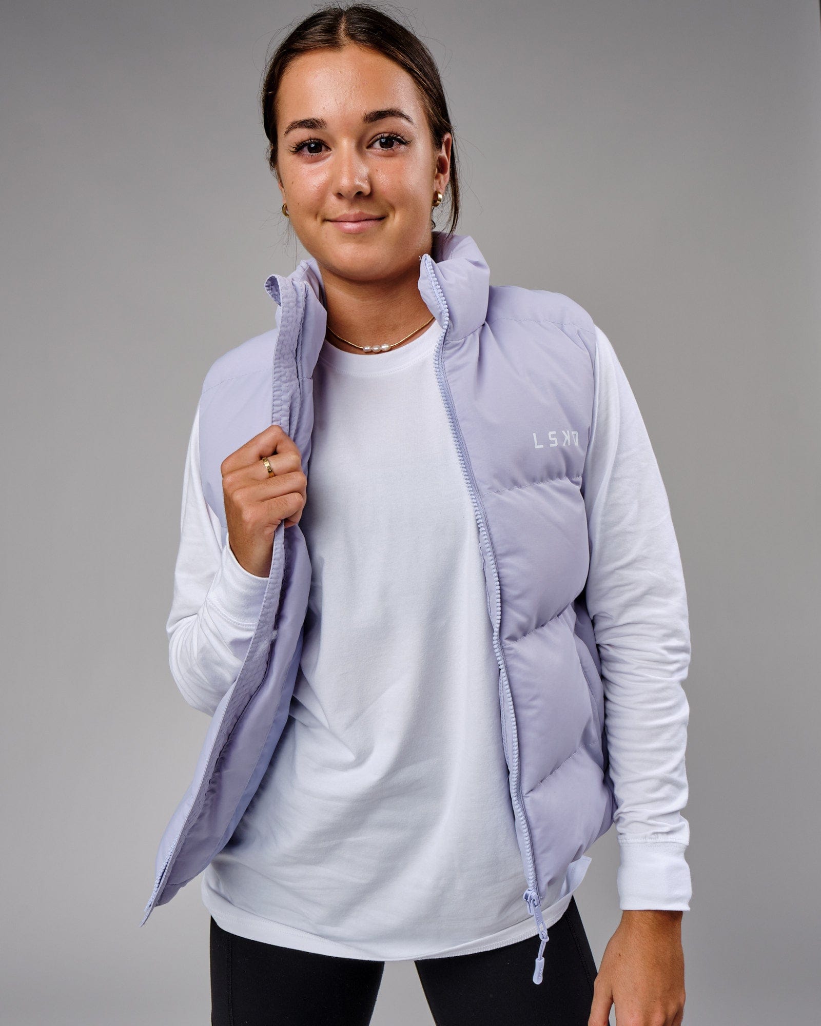 Model wearing Essential Puffer Vest - Cosmic Sky