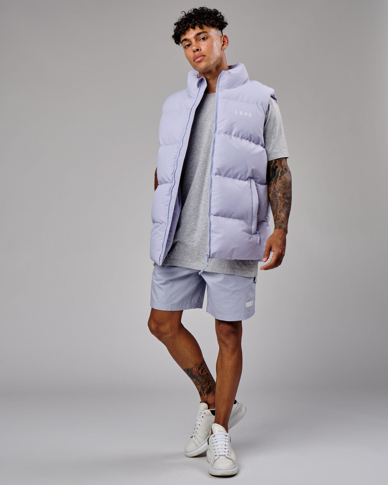 Model wearing Essential Puffer Vest - Cosmic Sky