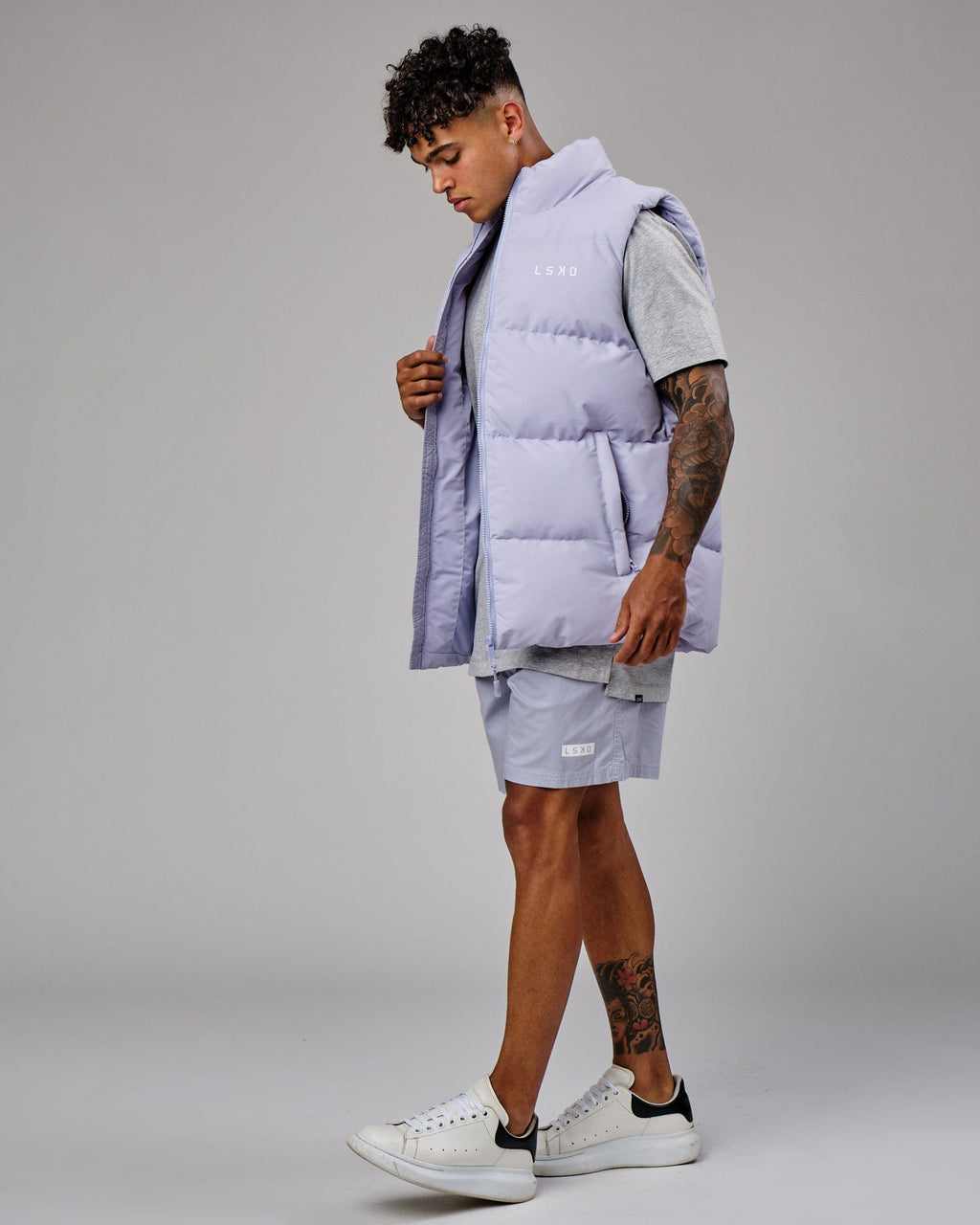 Model wearing Essential Puffer Vest - Cosmic Sky