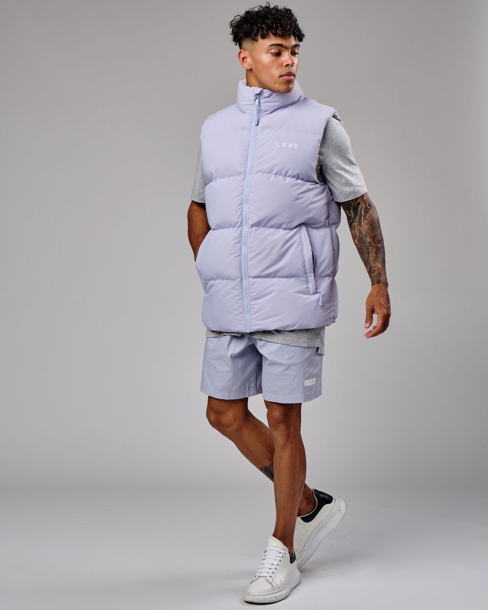 Model wearing Essential Puffer Vest - Cosmic Sky