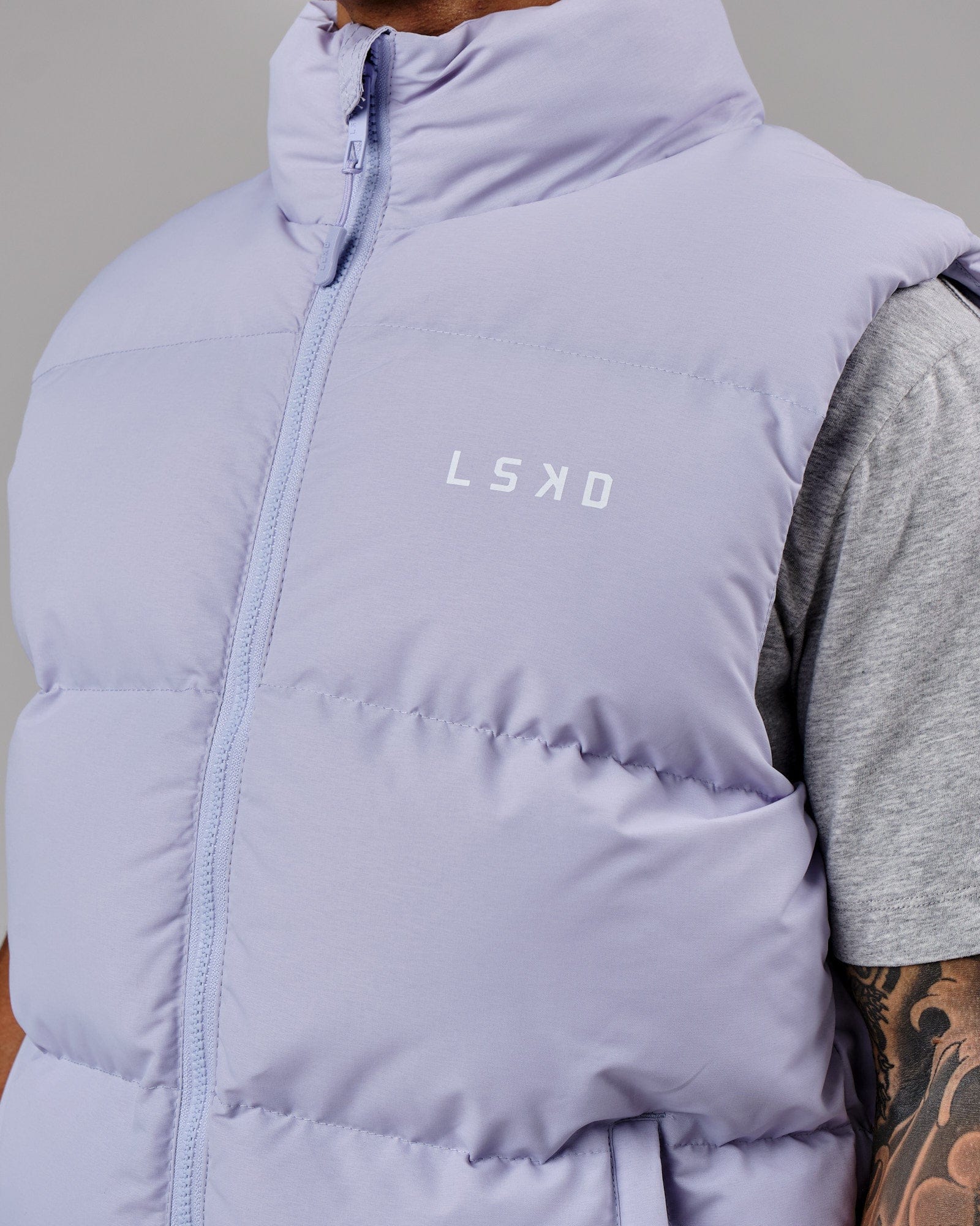 Model wearing Essential Puffer Vest - Cosmic Sky