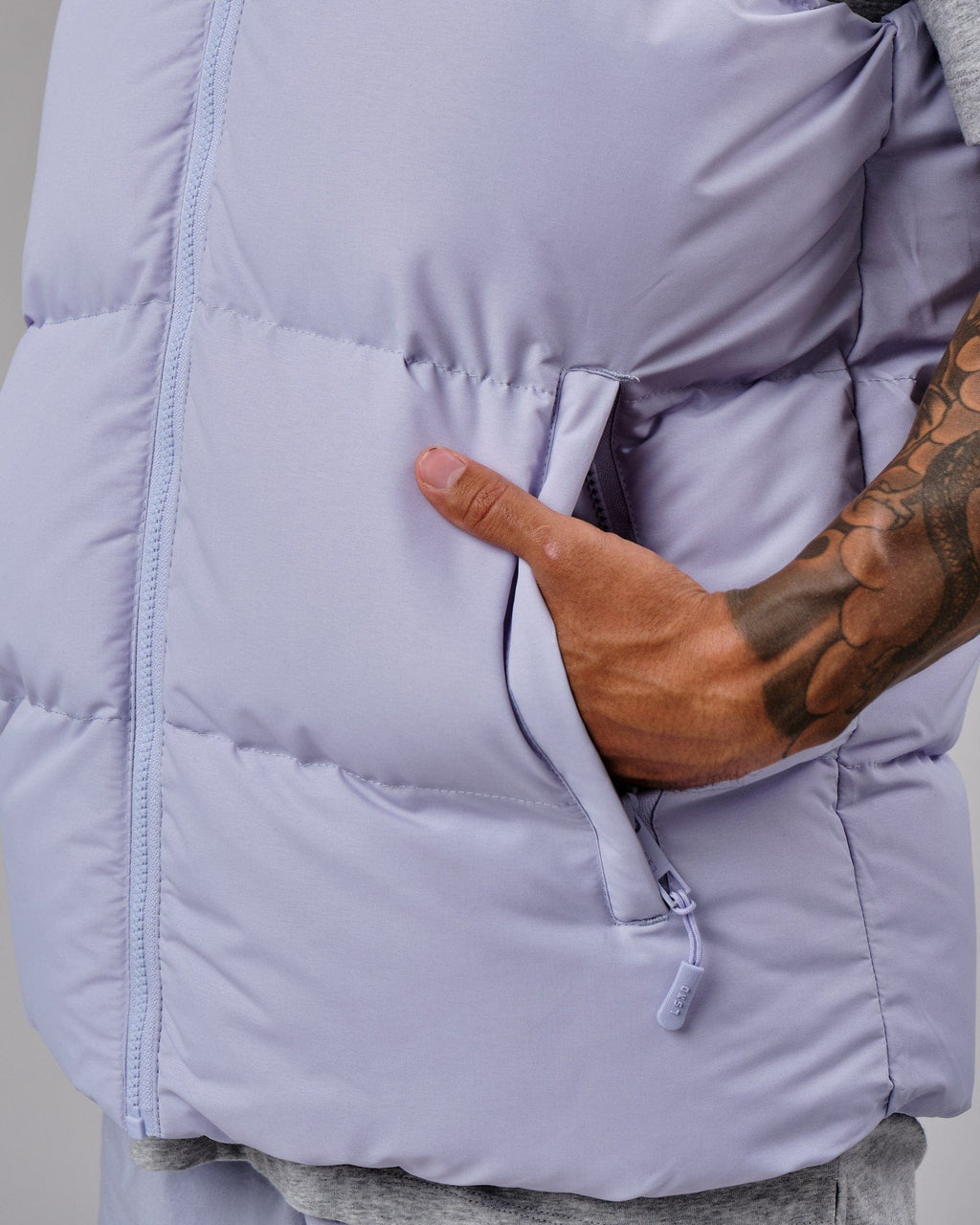 Model wearing Essential Puffer Vest - Cosmic Sky