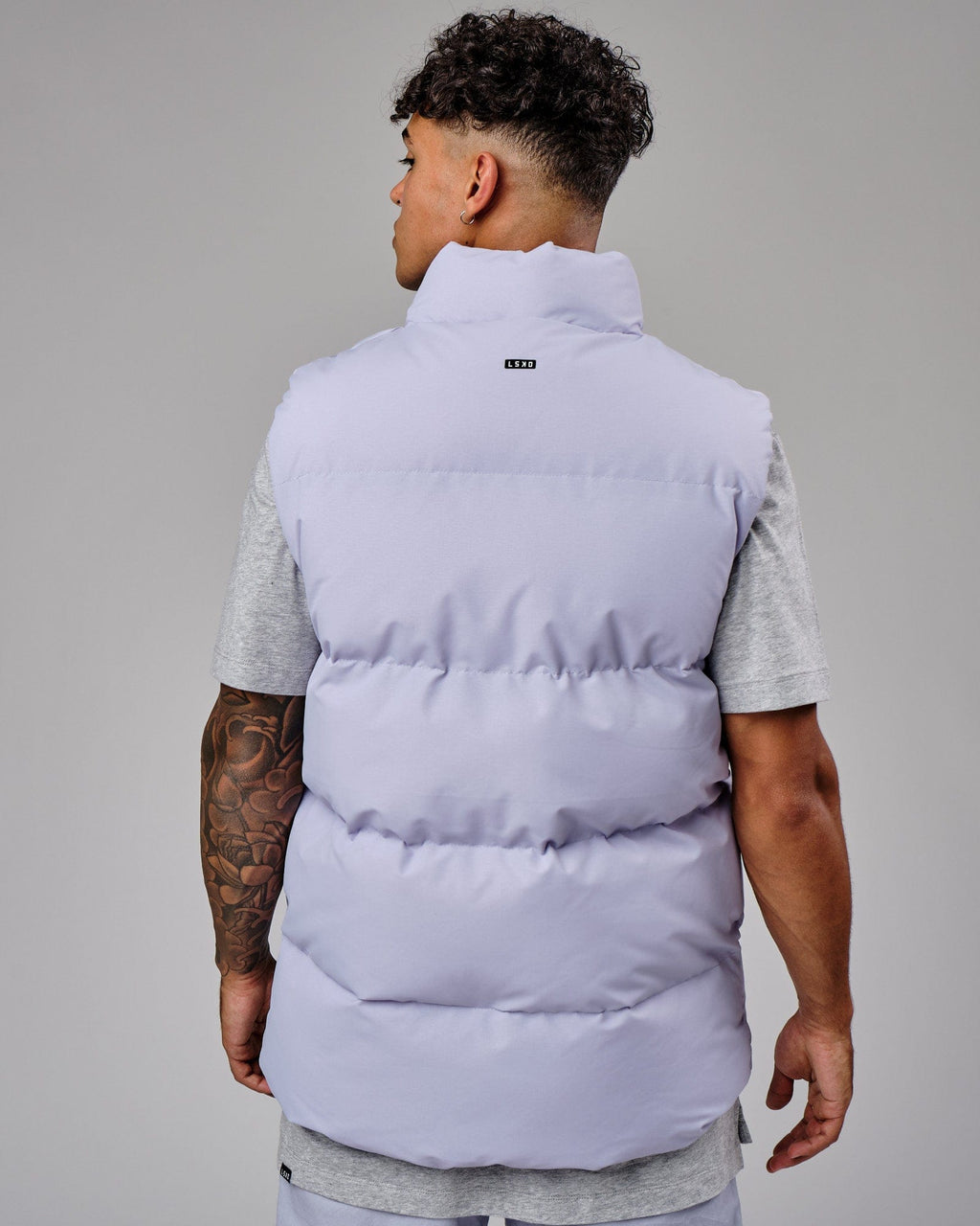 Model wearing Essential Puffer Vest - Cosmic Sky