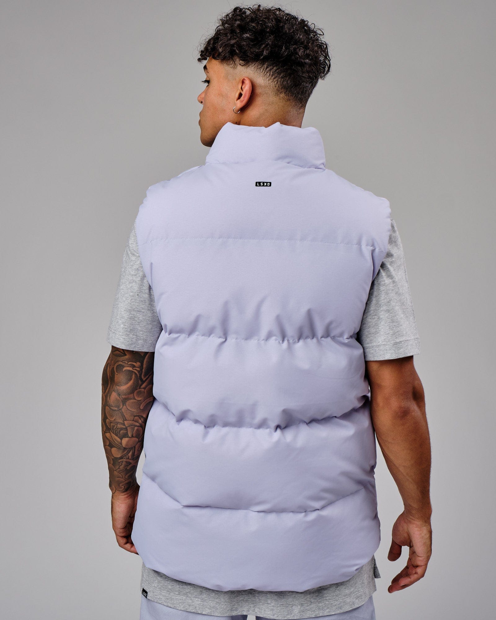 Model wearing Essential Puffer Vest - Cosmic Sky