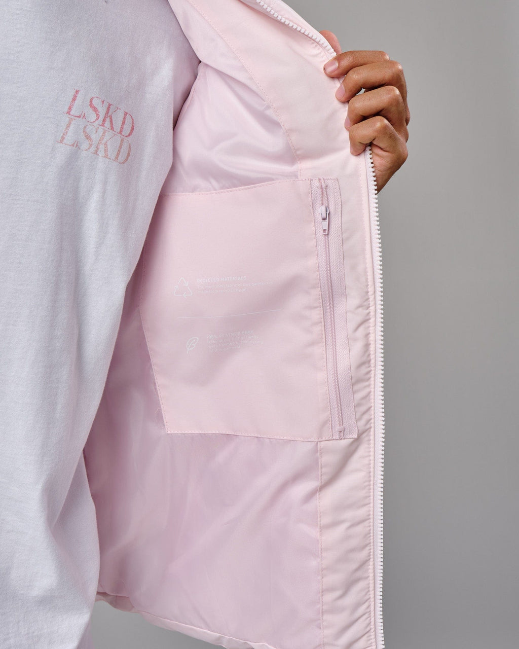 Model wearing Essential Puffer Vest - Orchid ice