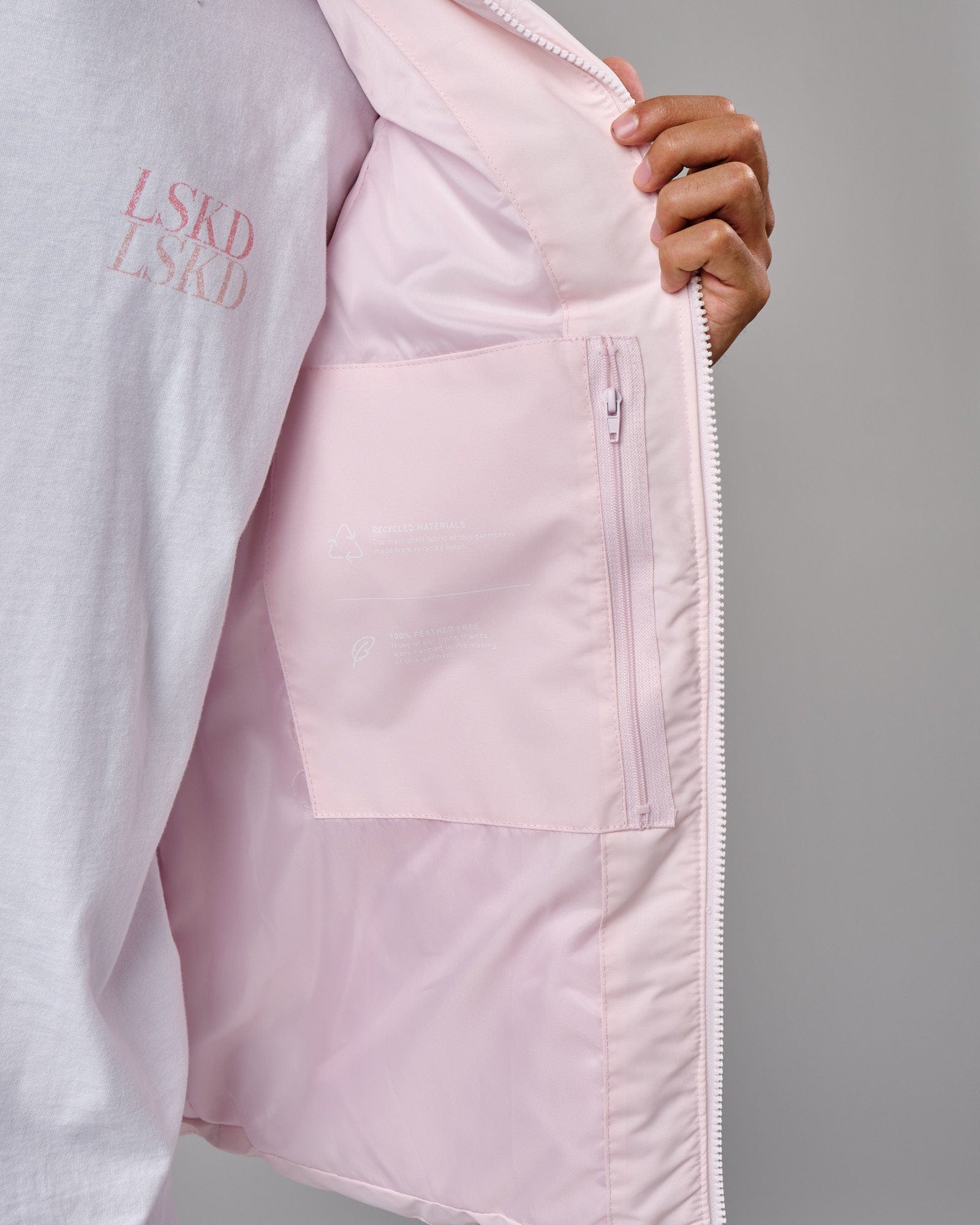 Model wearing Essential Puffer Vest - Orchid ice