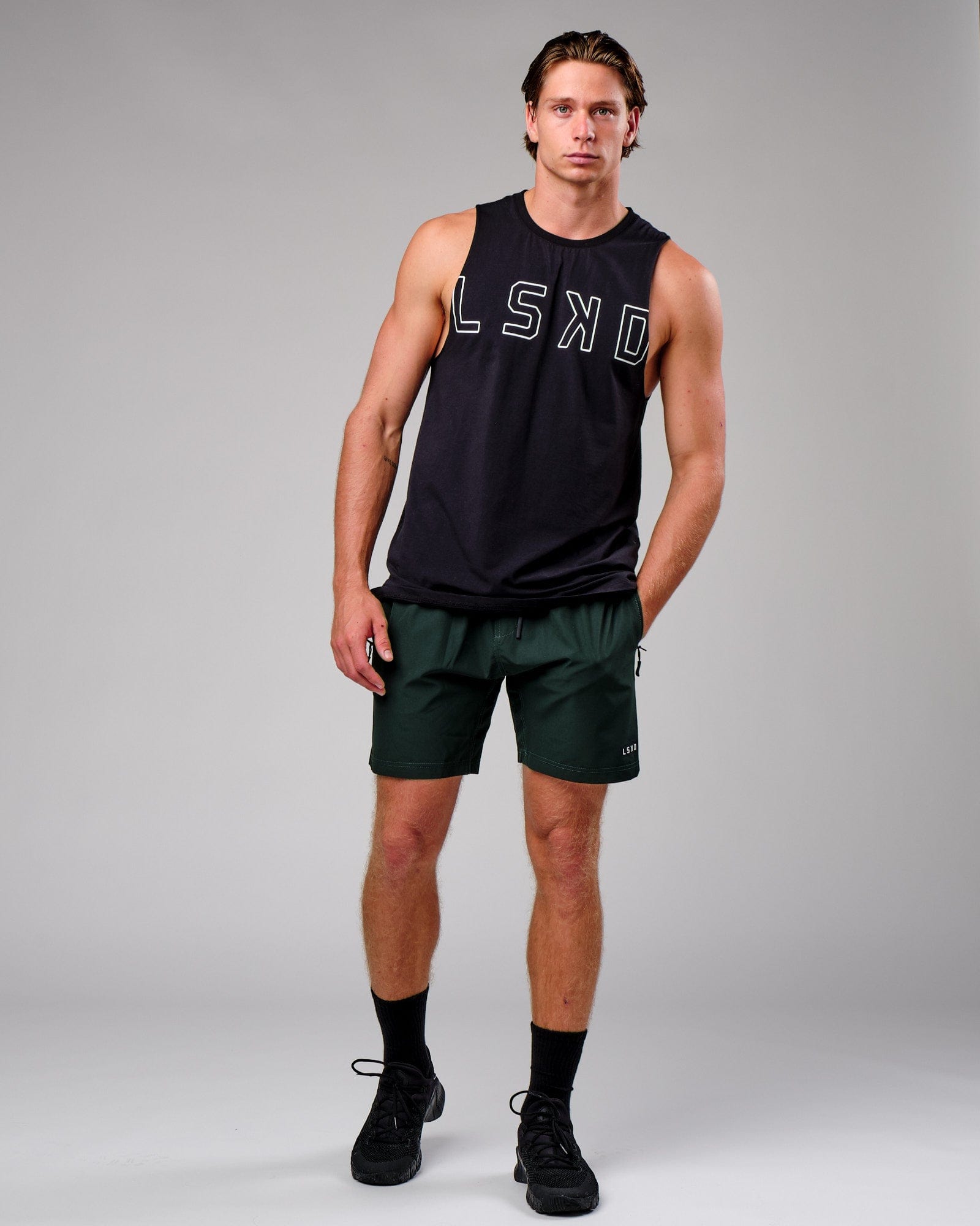 Model wearing Rep 7" Performance Short - Forest