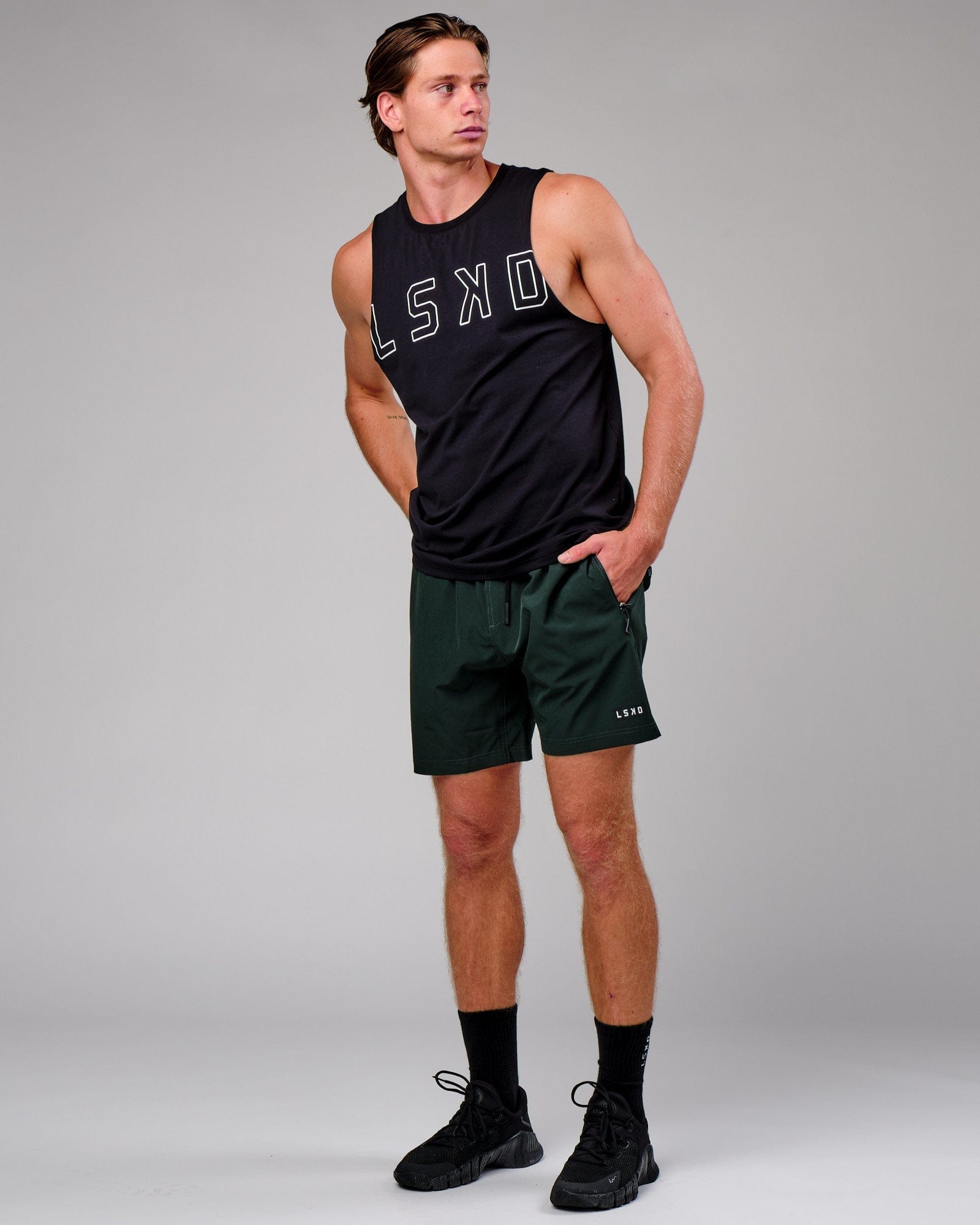 Model wearing Rep 7" Performance Short - Forest