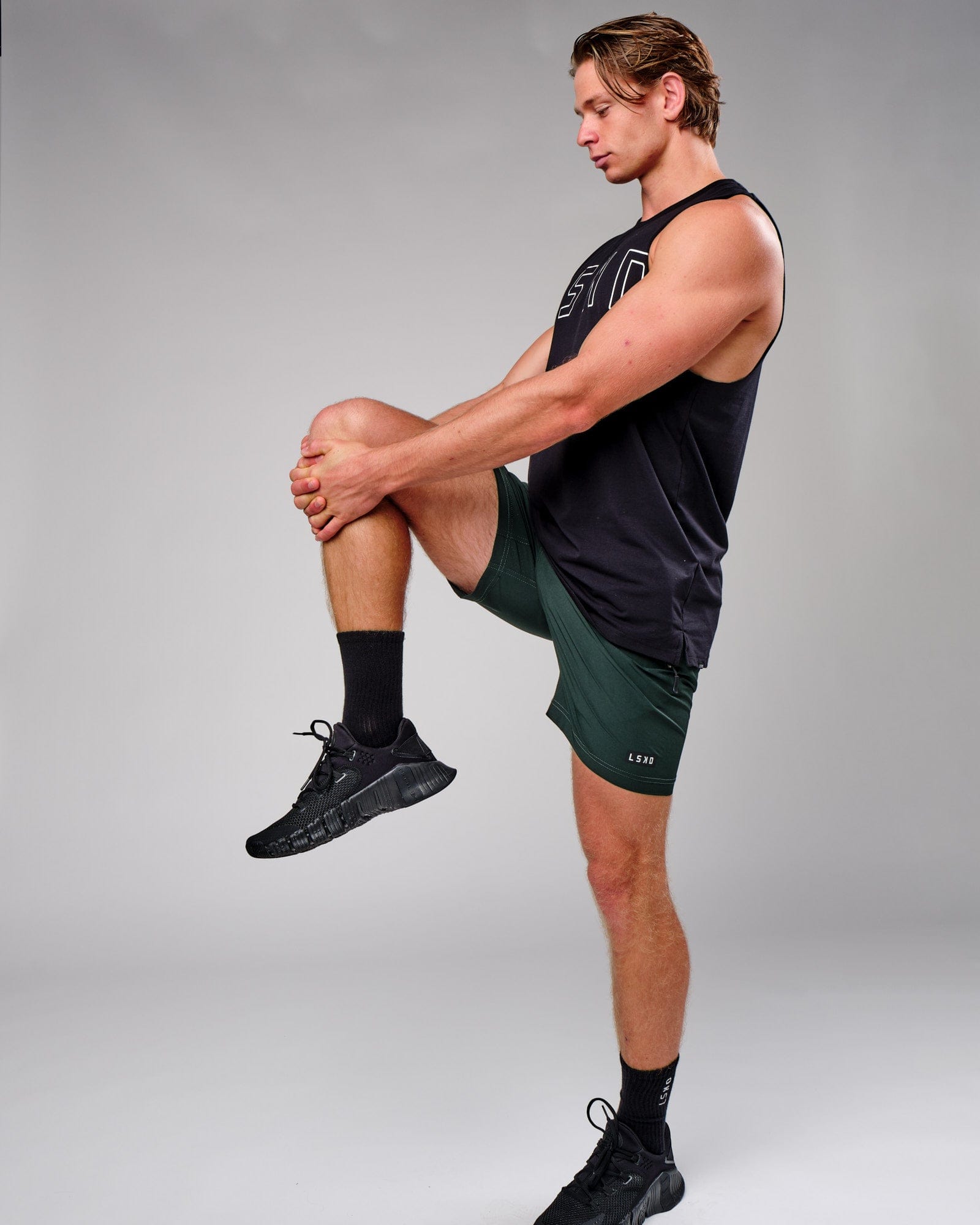 Model wearing Rep 7" Performance Short - Forest