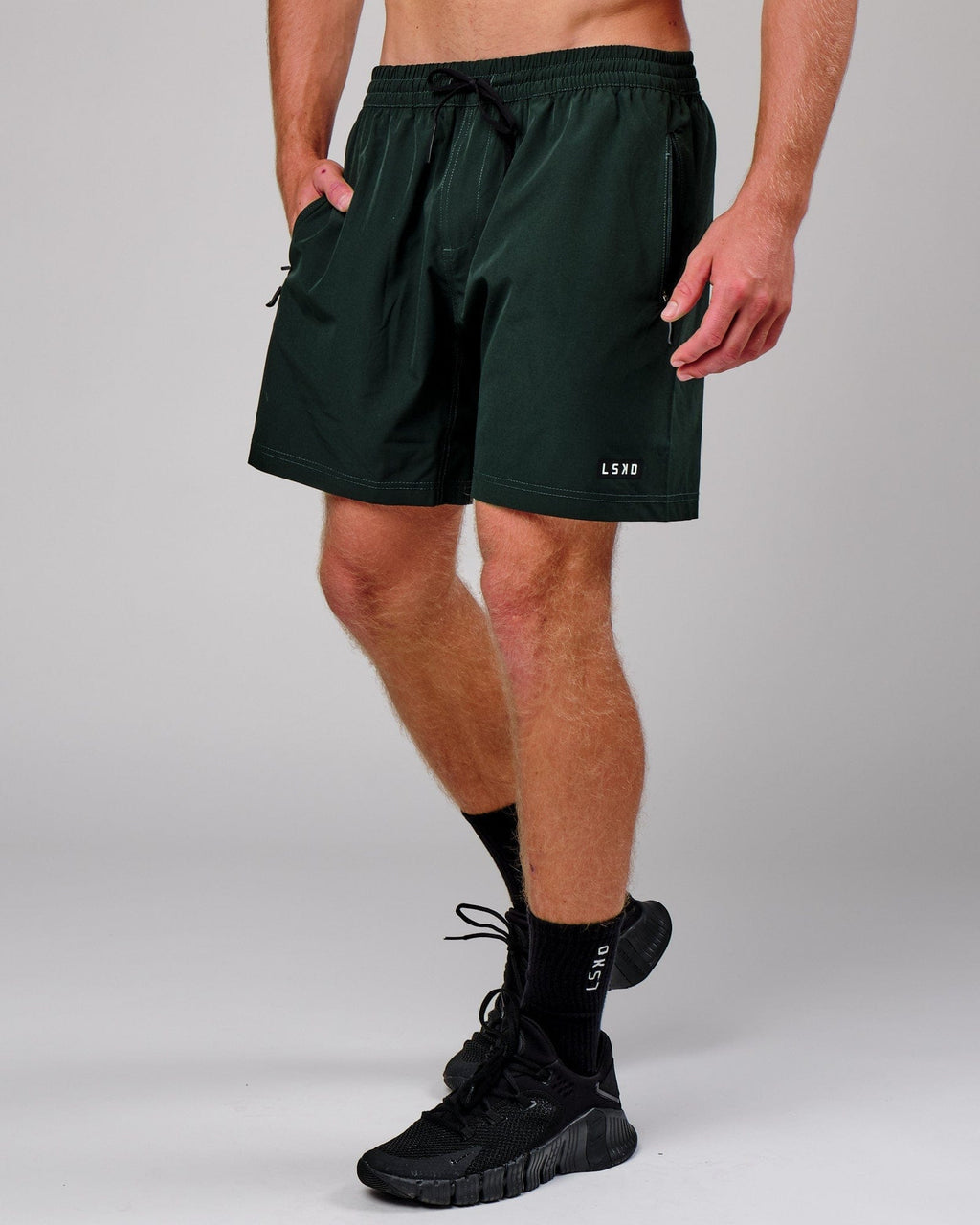 Model wearing Rep 7" Performance Short - Forest