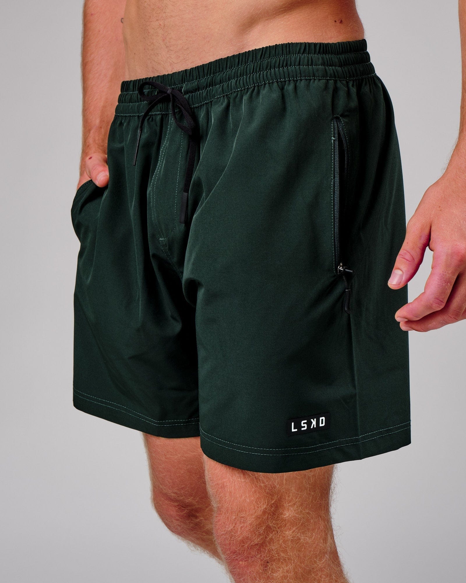 Model wearing Rep 7" Performance Short - Forest