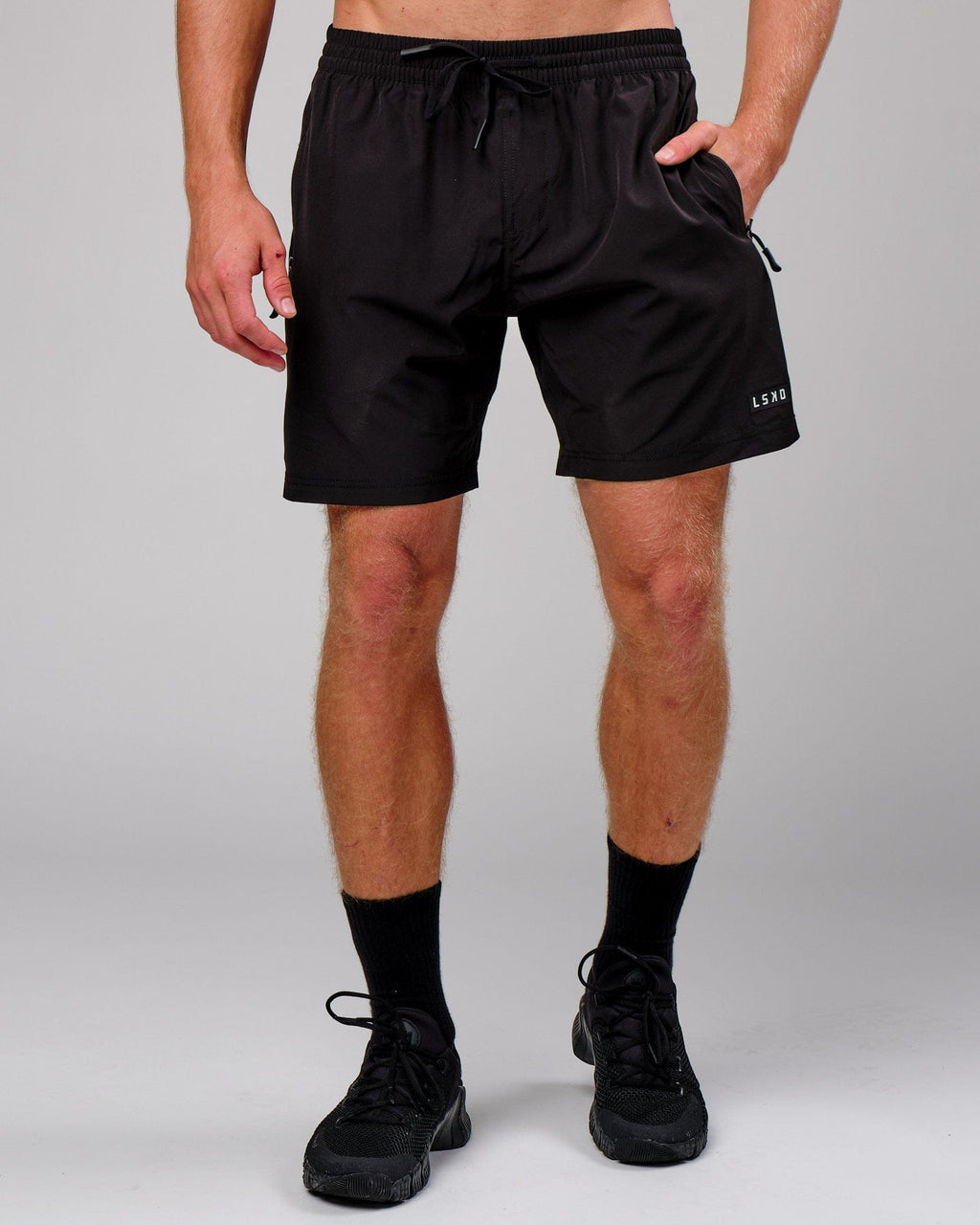 Model wearing Rep 7'' Performance Short - Black