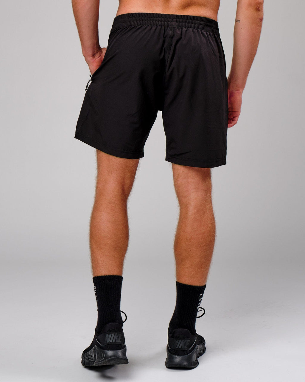 Model wearing Rep 7'' Performance Short - Black