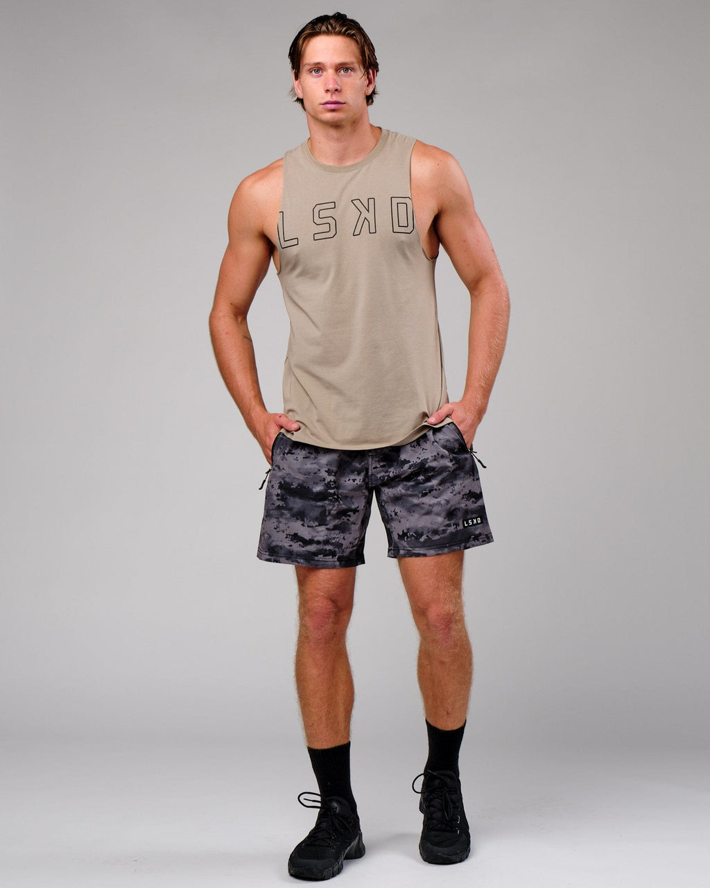 Model wearing Rep 7" Performance Short - Urban Camo