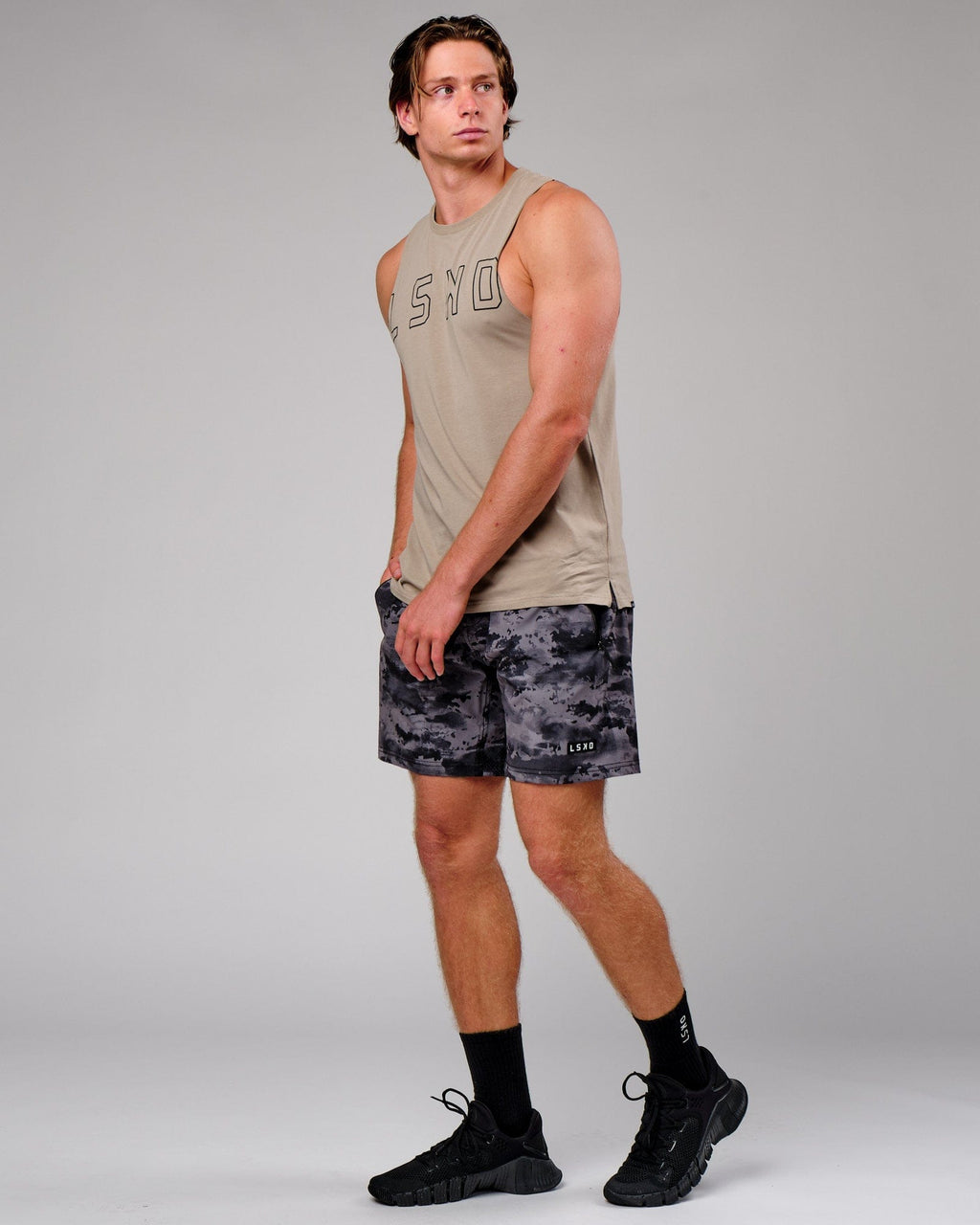 Model wearing Rep 7" Performance Short - Urban Camo
