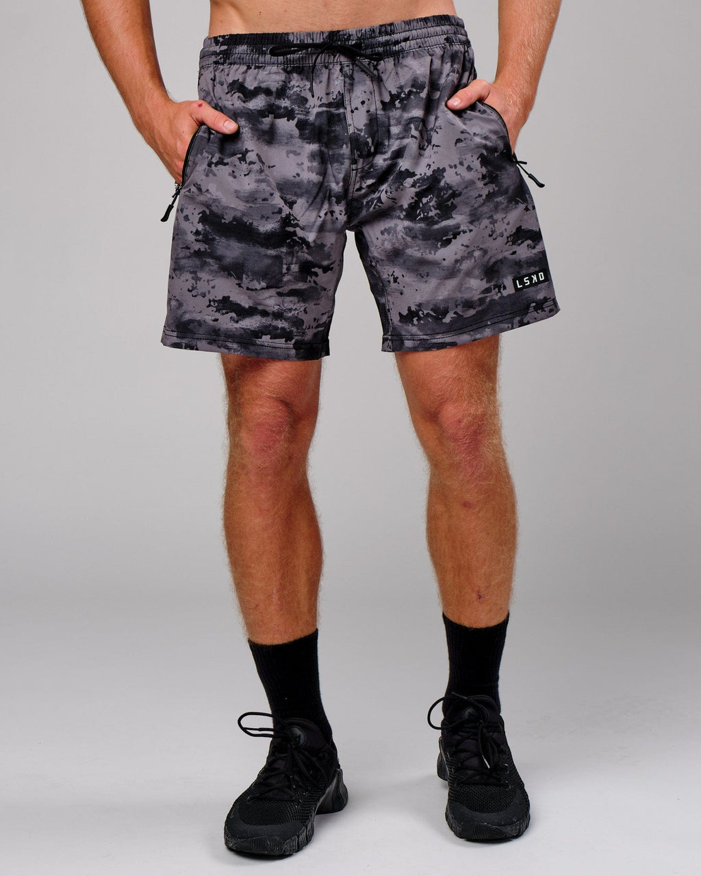 Model wearing Rep 7" Performance Short - Urban Camo