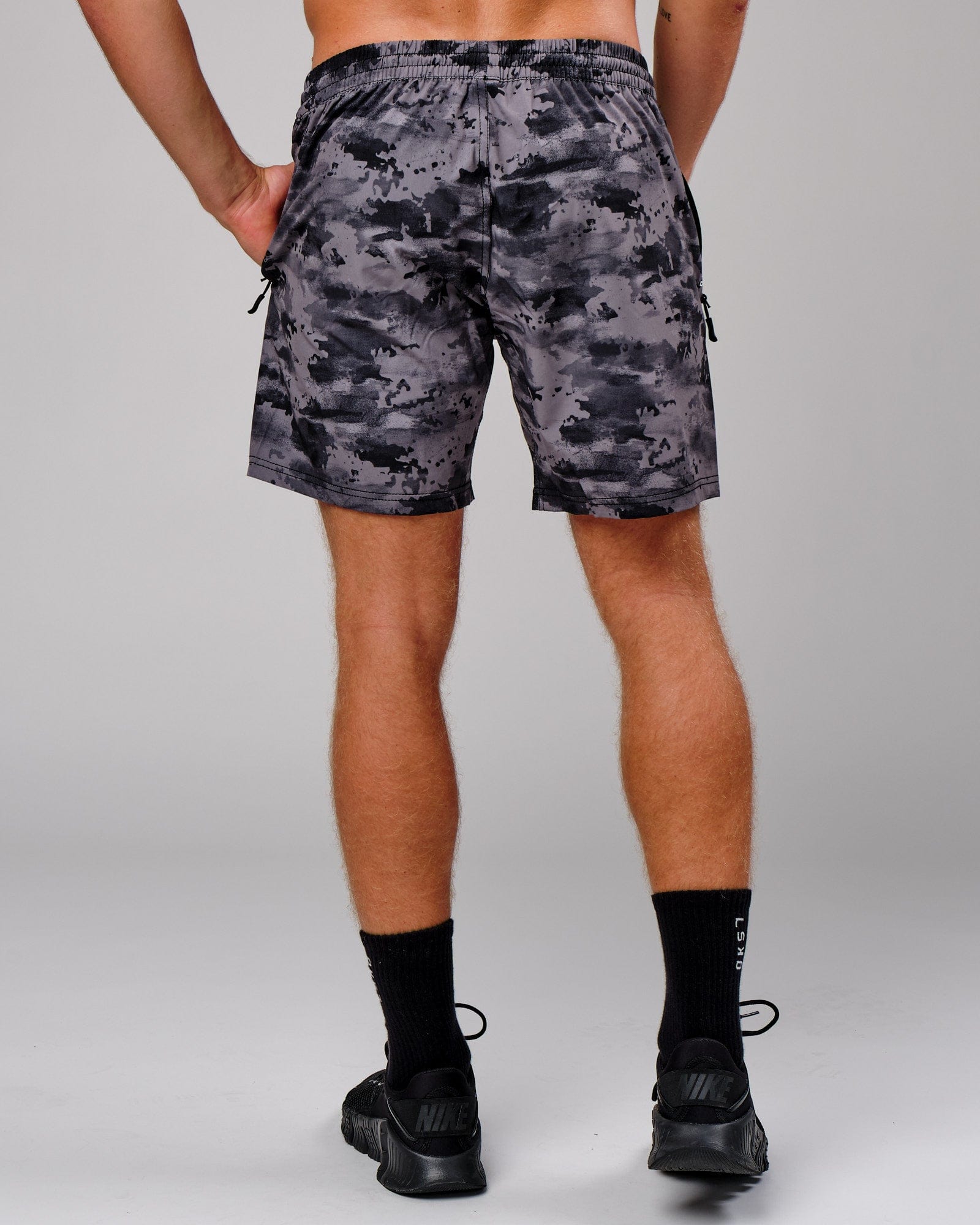 Model wearing Rep 7" Performance Short - Urban Camo