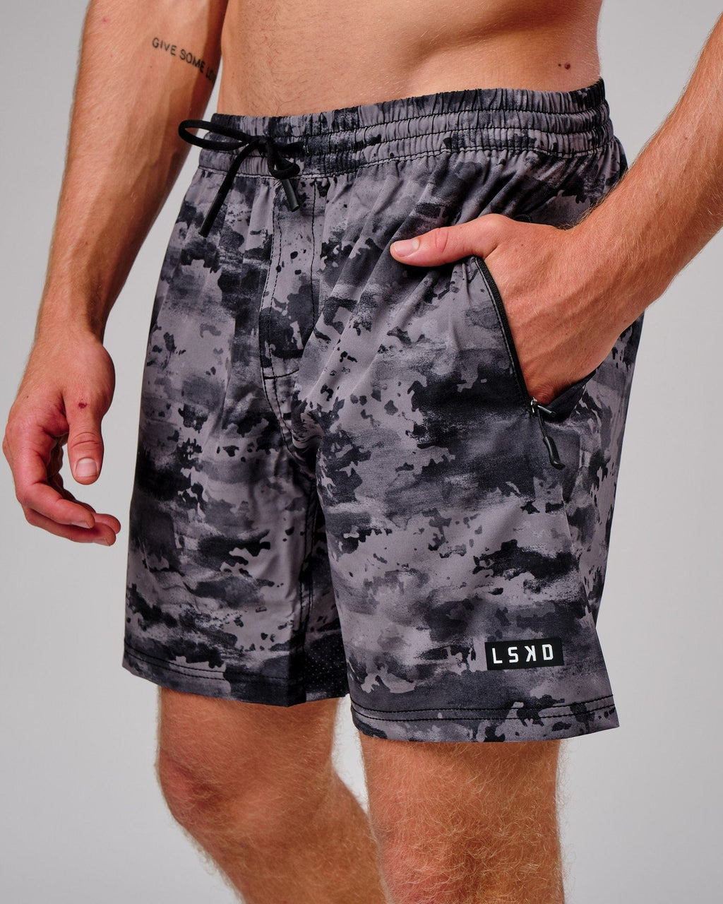 Model wearing Rep 7" Performance Short - Urban Camo