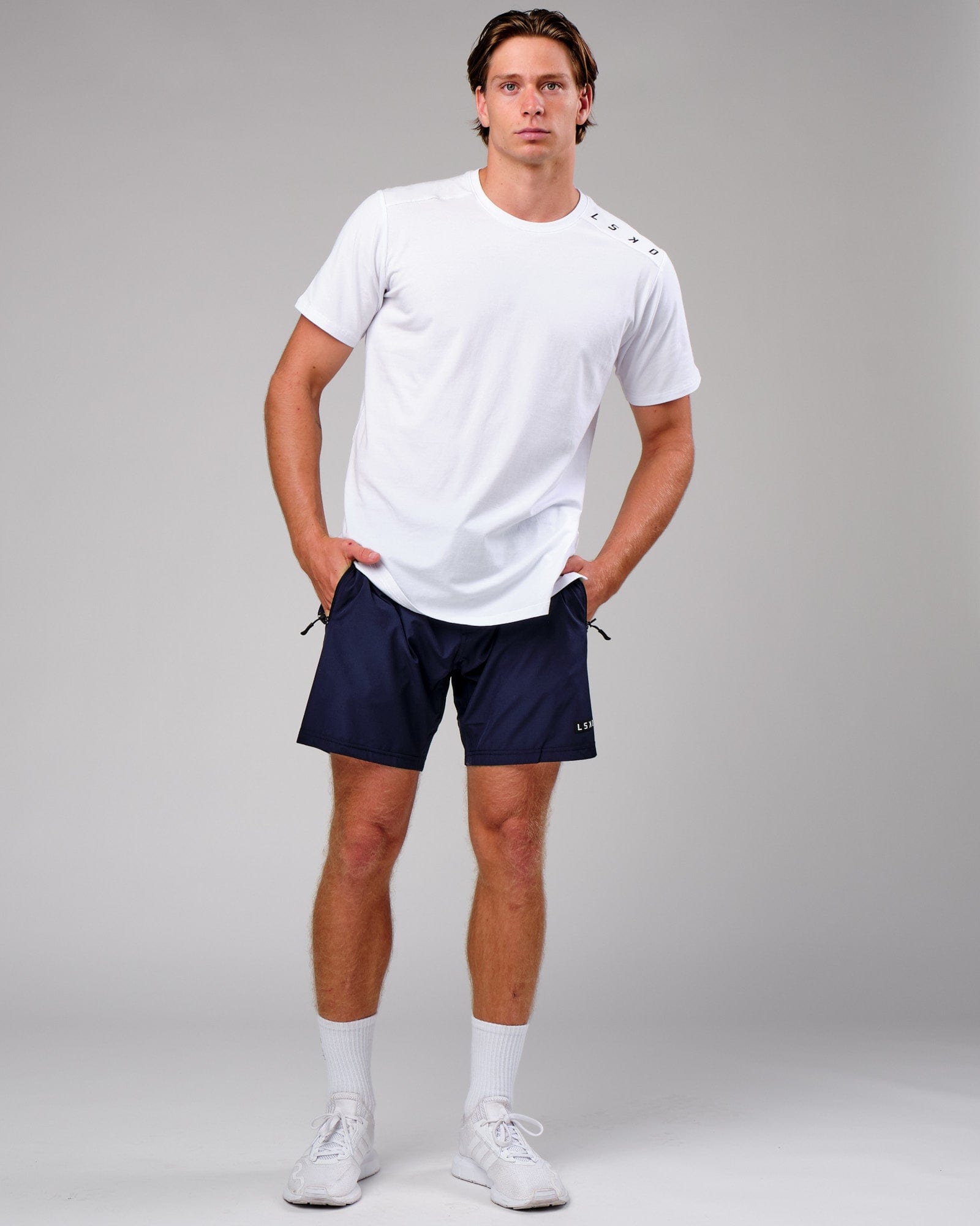 Model wearing Rep 7" Performance Short - Navy