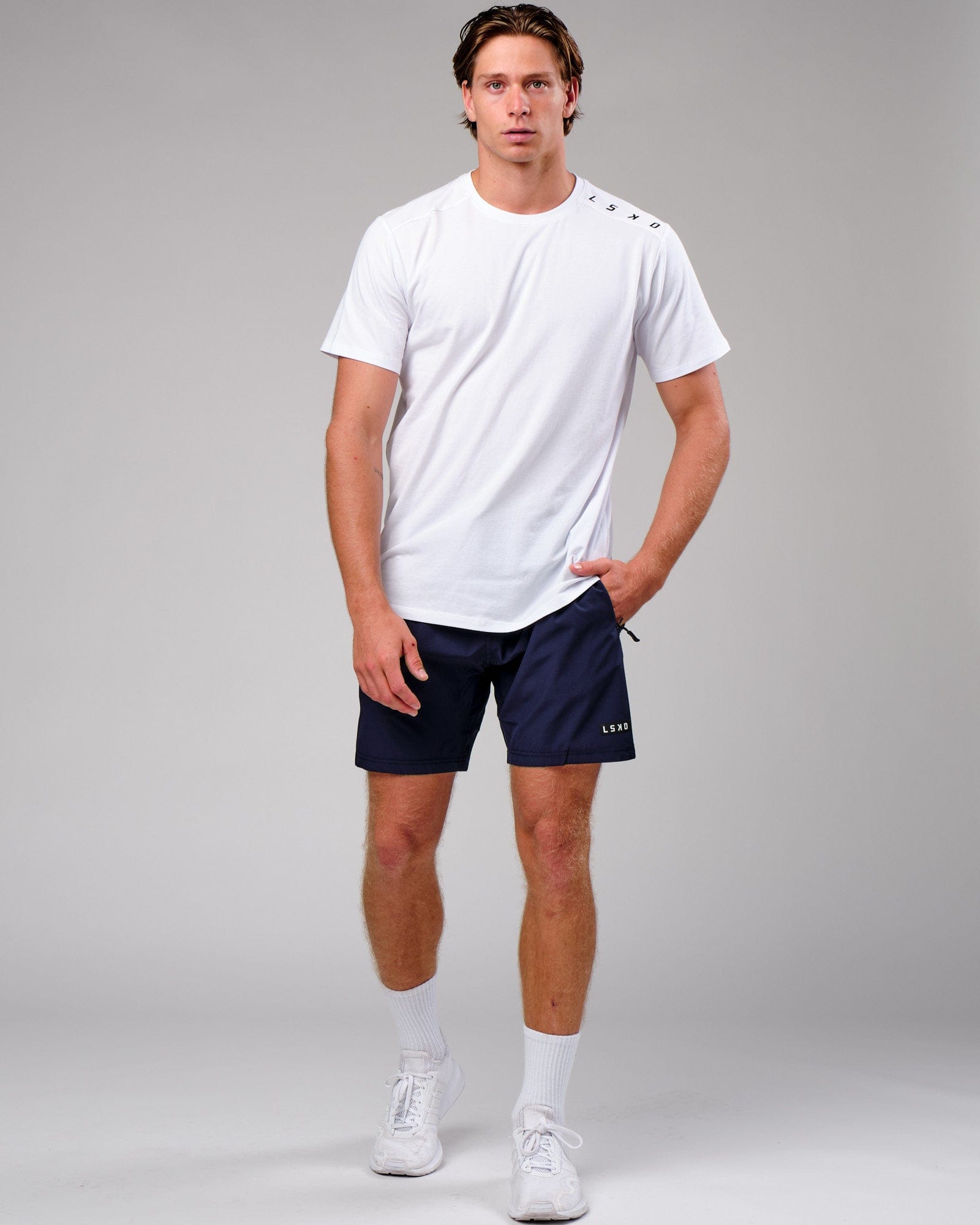 Model wearing Rep 7" Performance Short - Navy