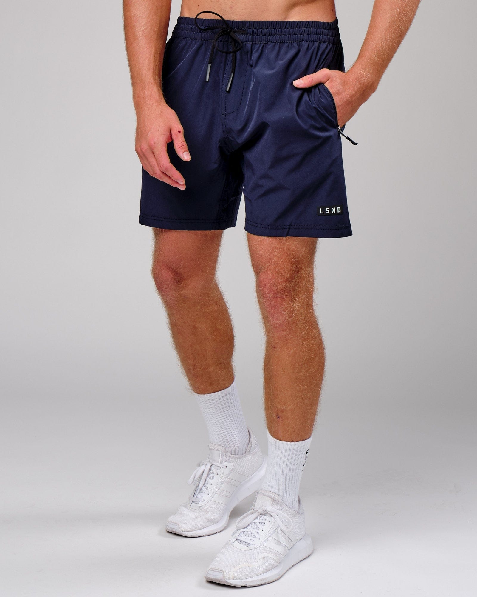 Model wearing Rep 7" Performance Short - Navy