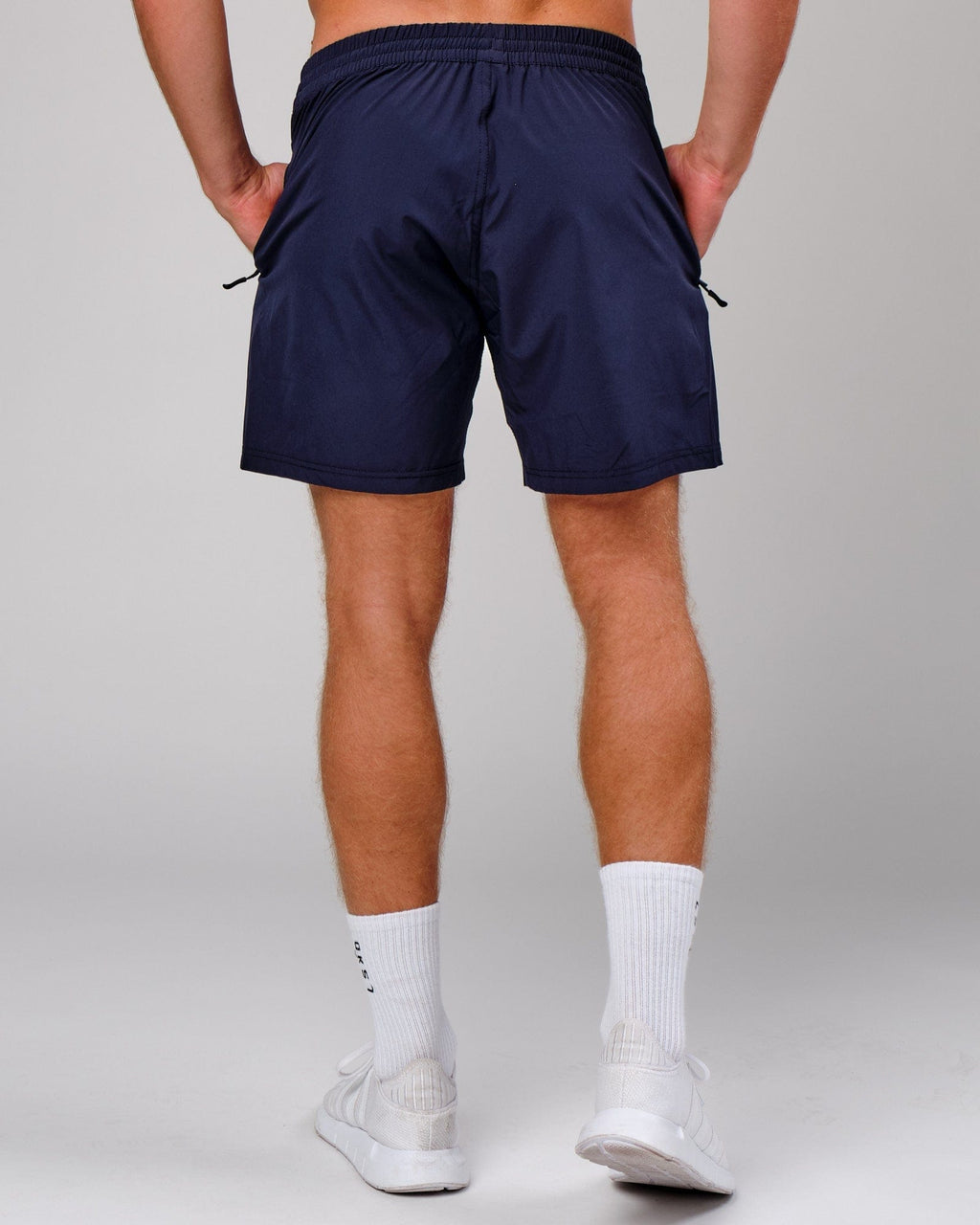 Model wearing Rep 7" Performance Short - Navy
