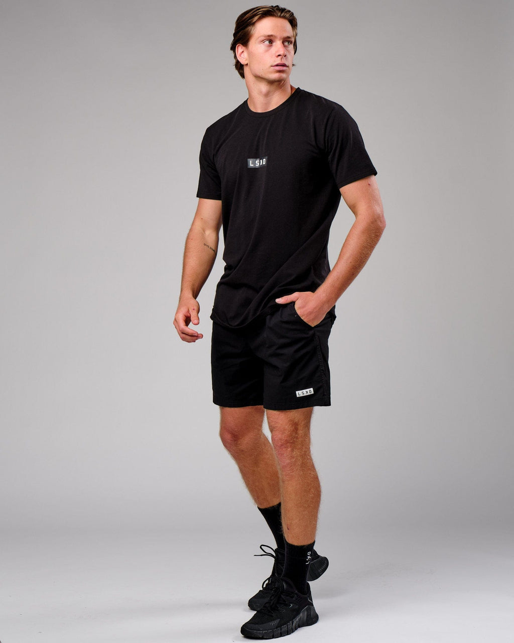 Model wearing Velocity Tee - Black