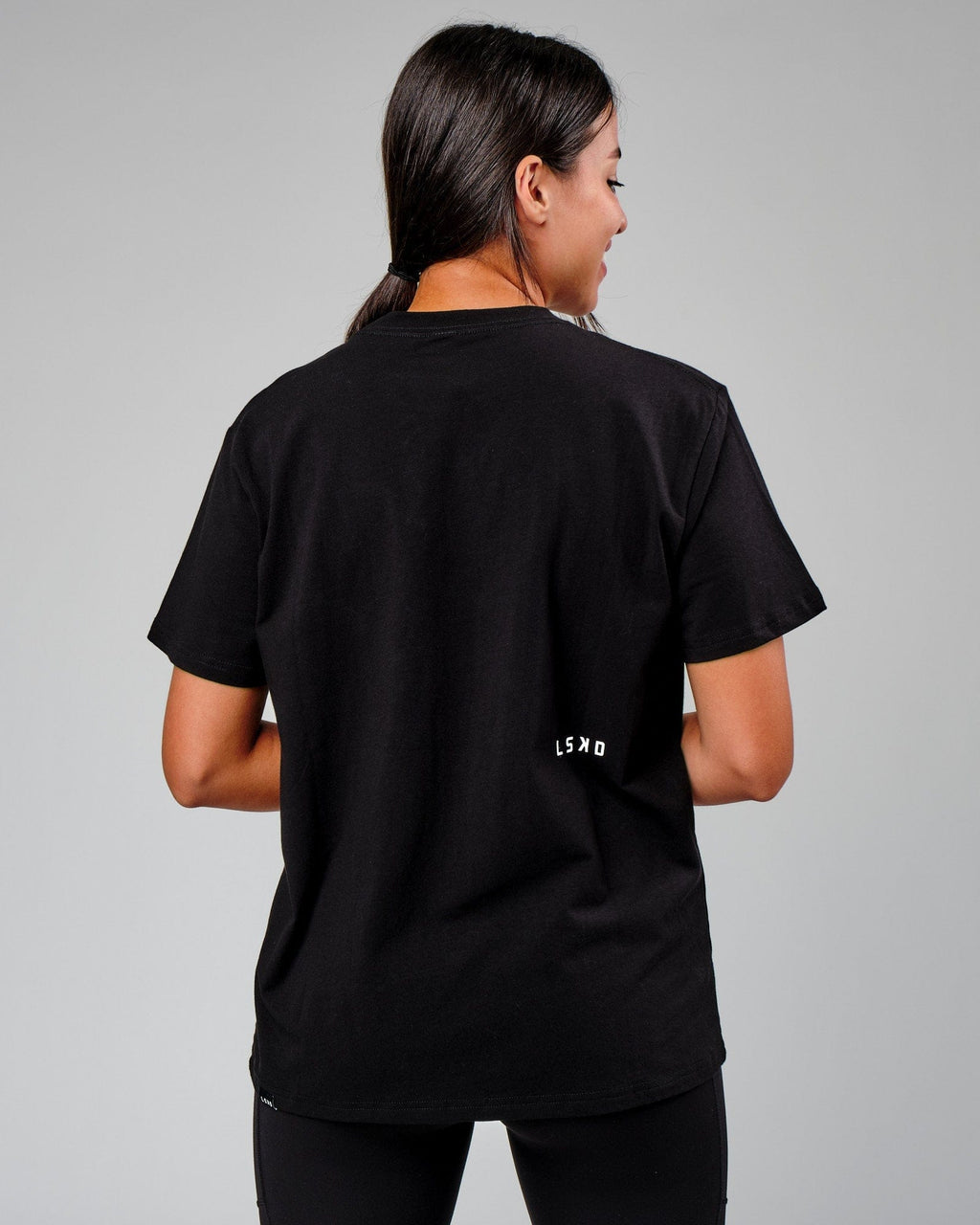 Model wearing Velocity Tee - Black