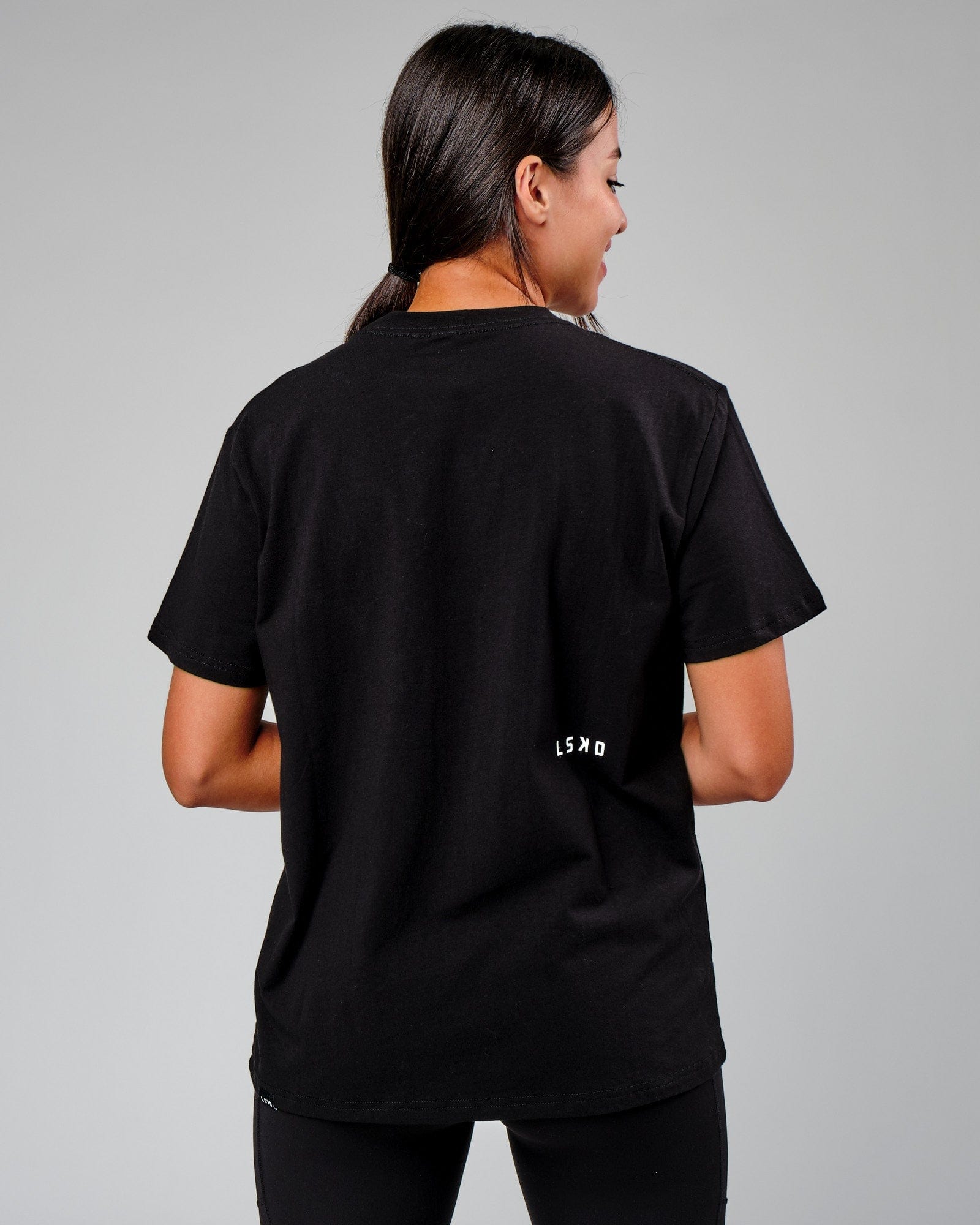 Model wearing Velocity Tee - Black