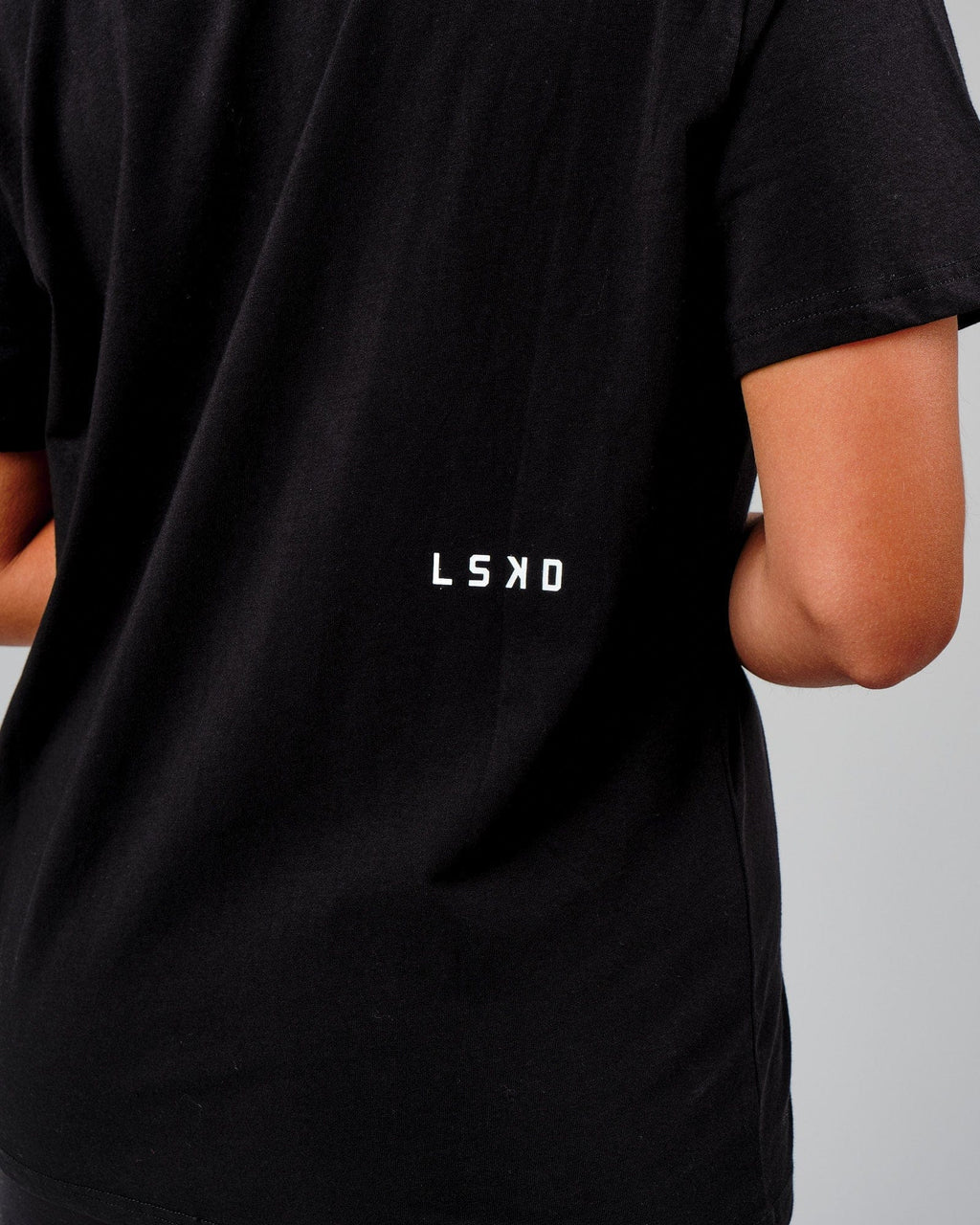 Model wearing Velocity Tee - Black