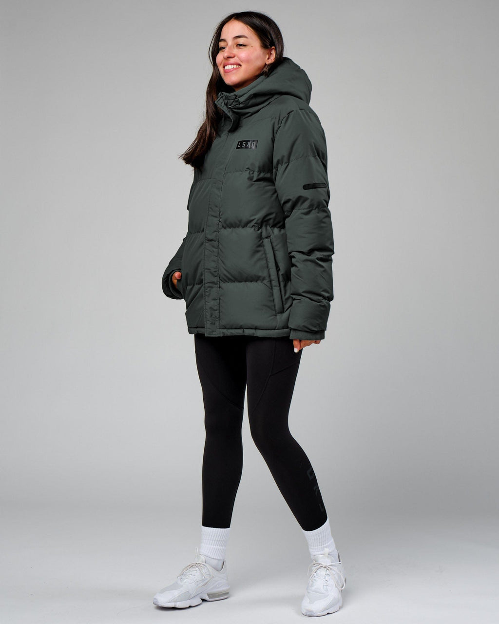 Model wearing Unisex Roasted Puffer Jacket Oversize 22 - Carbon Green